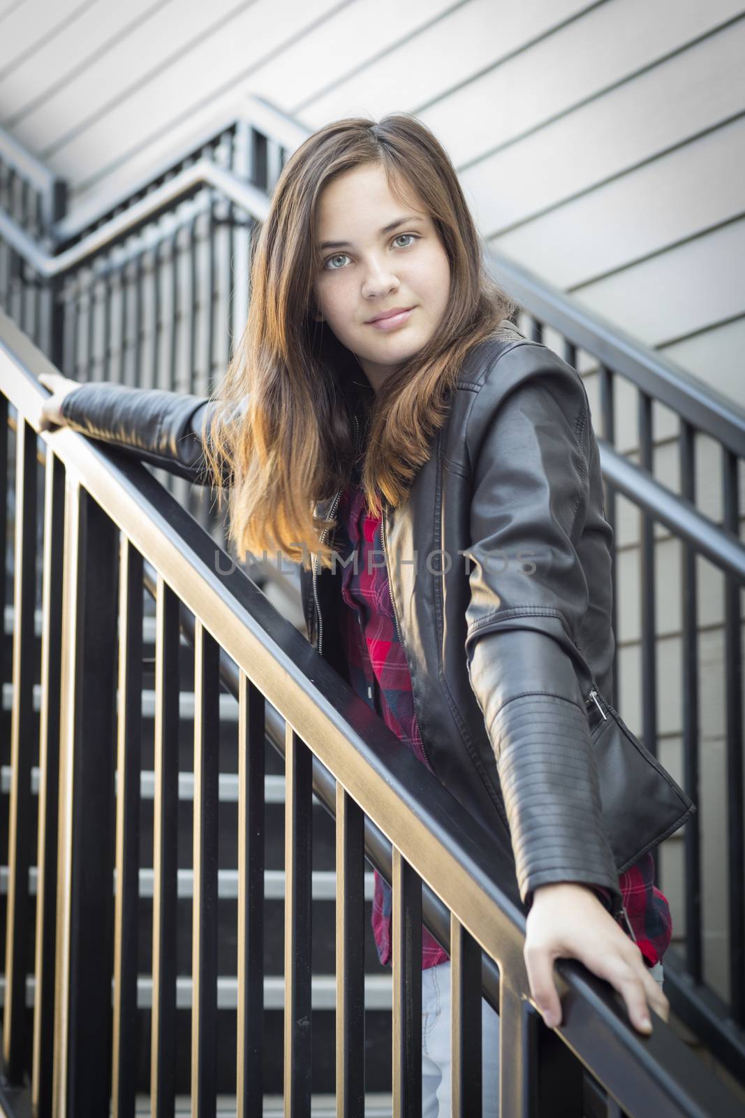 Portrait of Pretty Young Girl Weather Leather Jacket on Staircase.