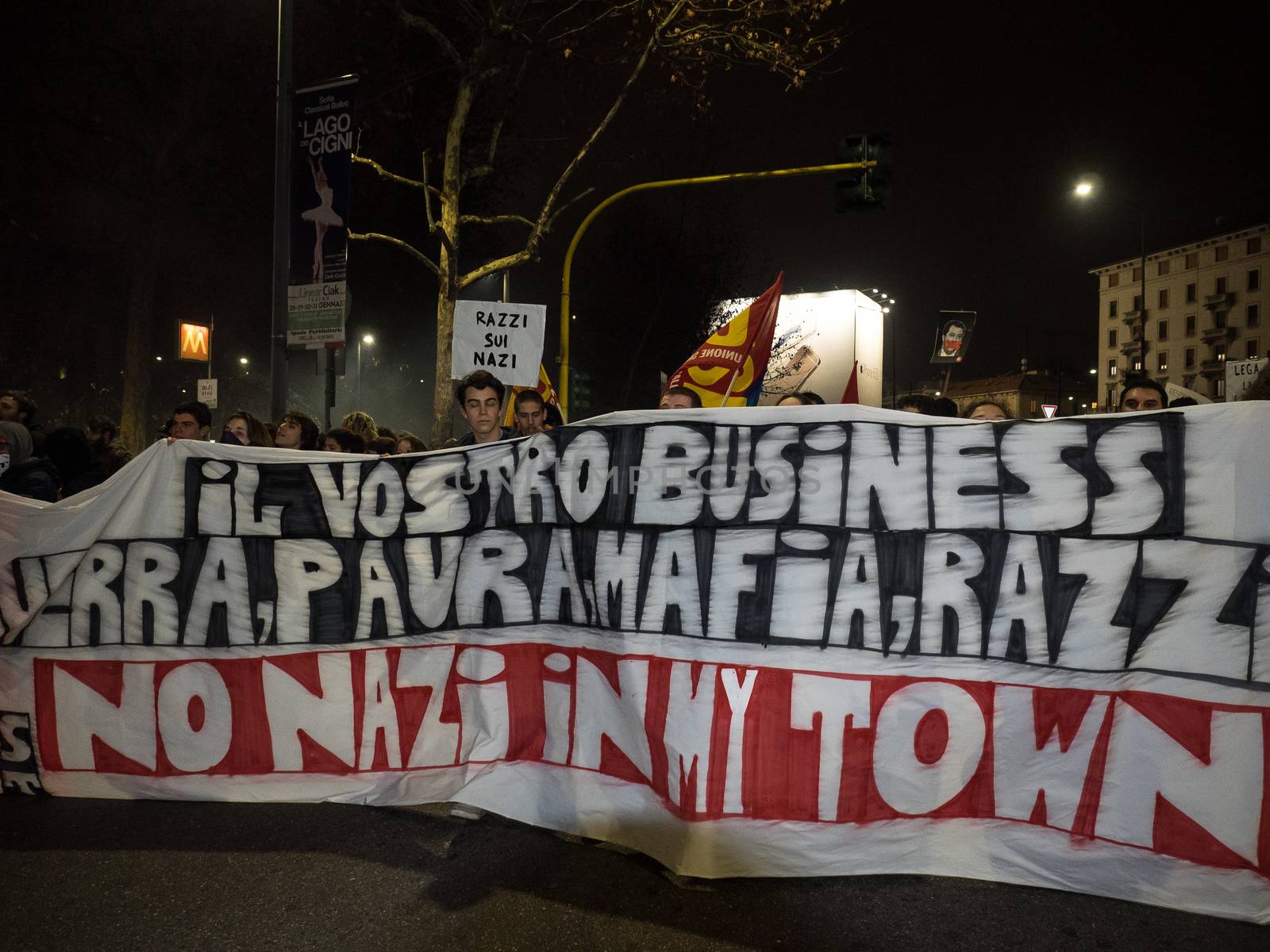 ITALY, Milan: Members of the Anti-Fascist Network of Milan march to protest against the meeting of Italian Secretary of the Northern League Matteo Salvini, French President of the National Front Marine Le Pen, and other officials at MiCo in Milan, Italy on January 28, 2016. Carrying pro-refugee signs, the protesters march through the city and launch fireworks.