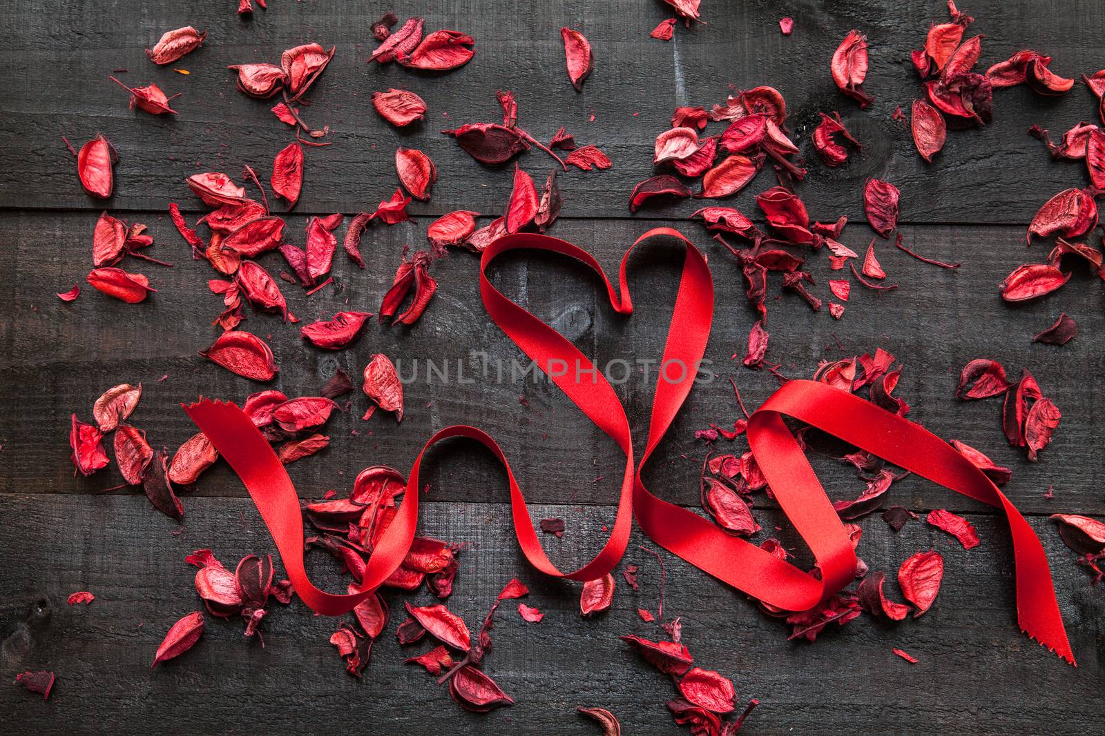 The image shows a wooden table with special composition for Saint Valentine, mother's day, father's day, christmas, love, marriage, dating....