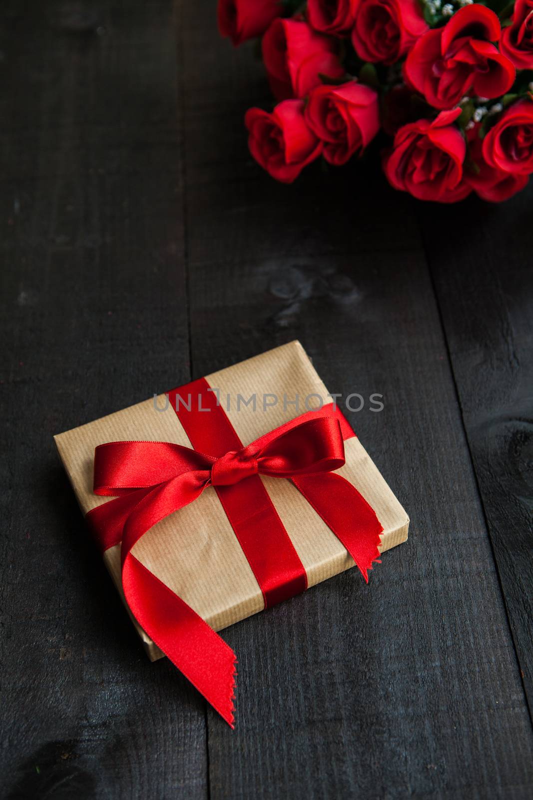 The image shows a wooden table with special composition for Saint Valentine, mother's day, father's day, christmas, love, marriage, dating....
