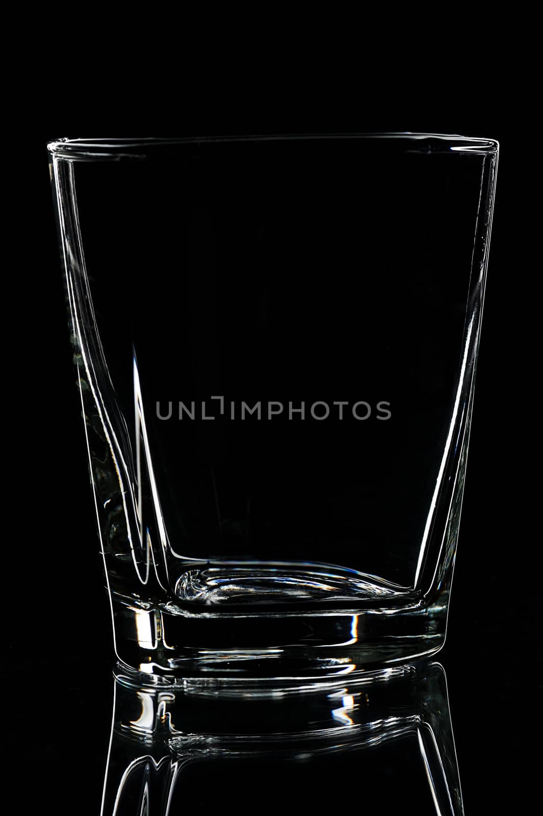 silhouette of Empty glass for whisky on black backgrounds