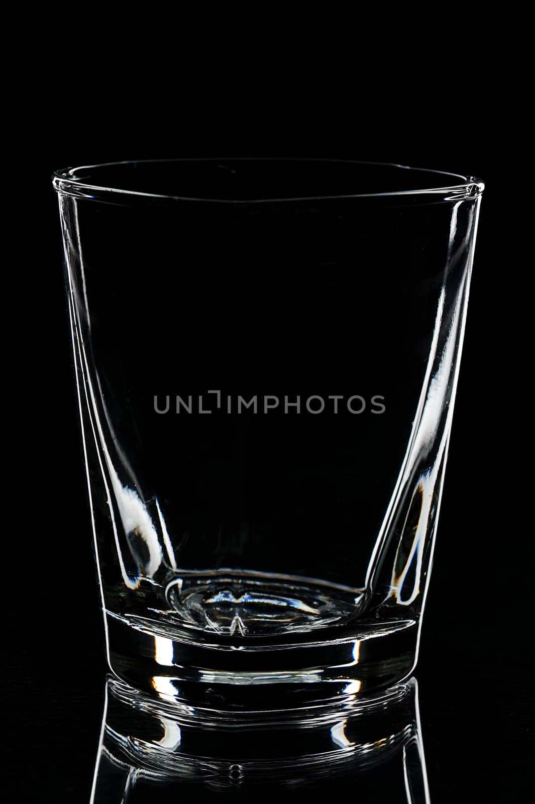 silhouette of empty glass for brande on black background