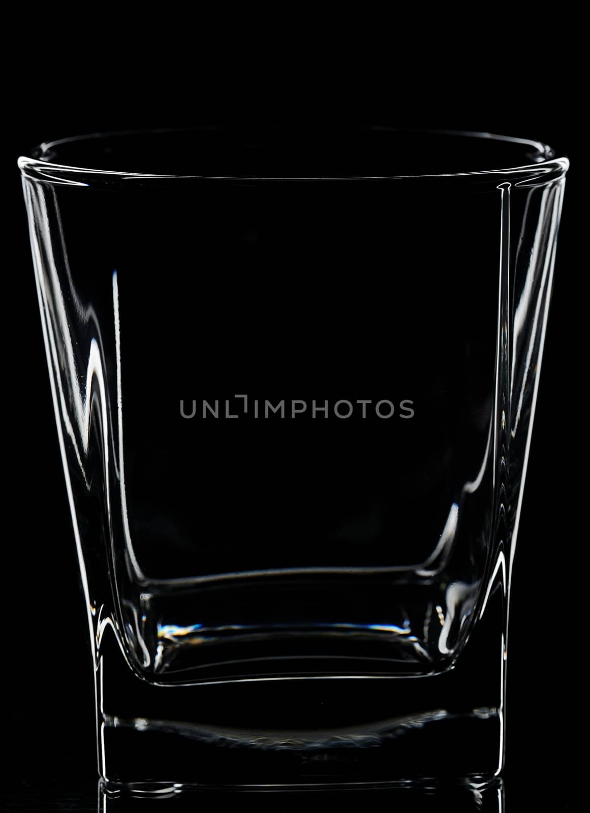 silhouette of square glass for whisky on black background