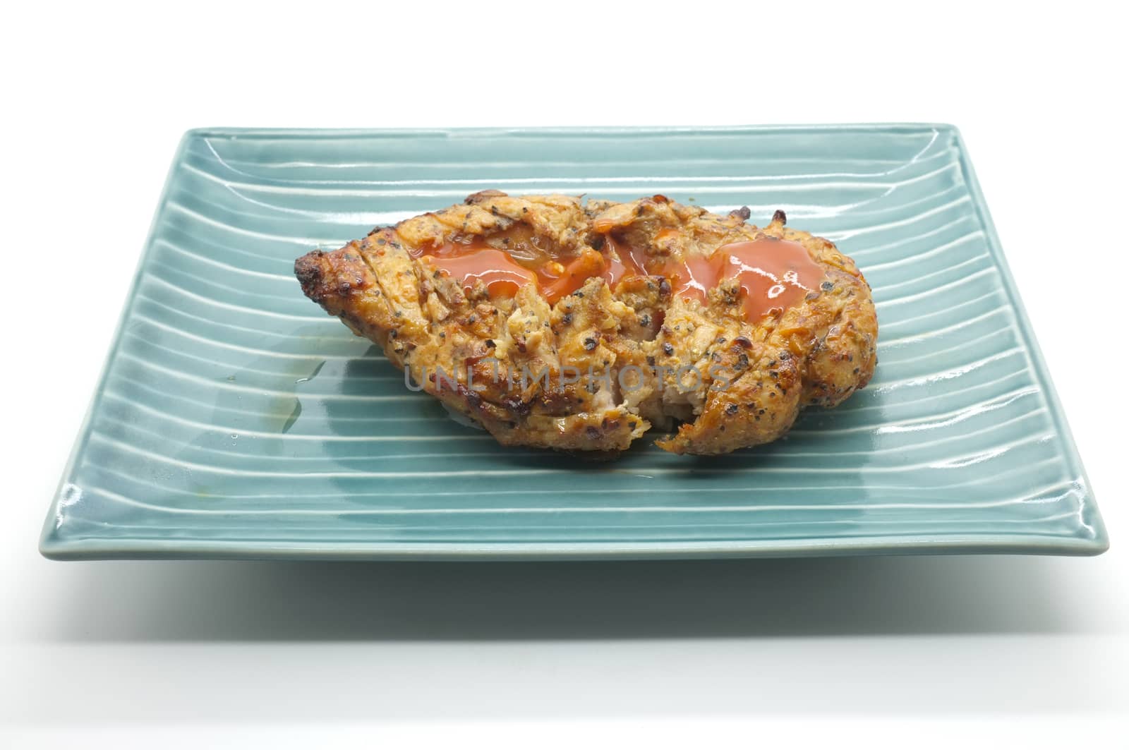 Grilled chicken meat on dish