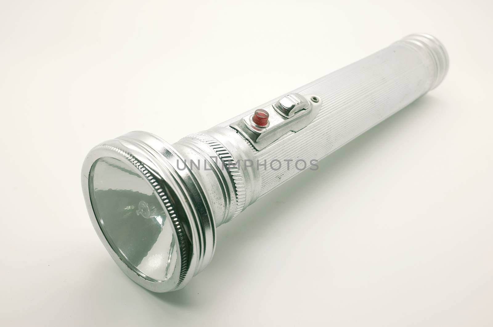 Old metal flashlight, silver torch