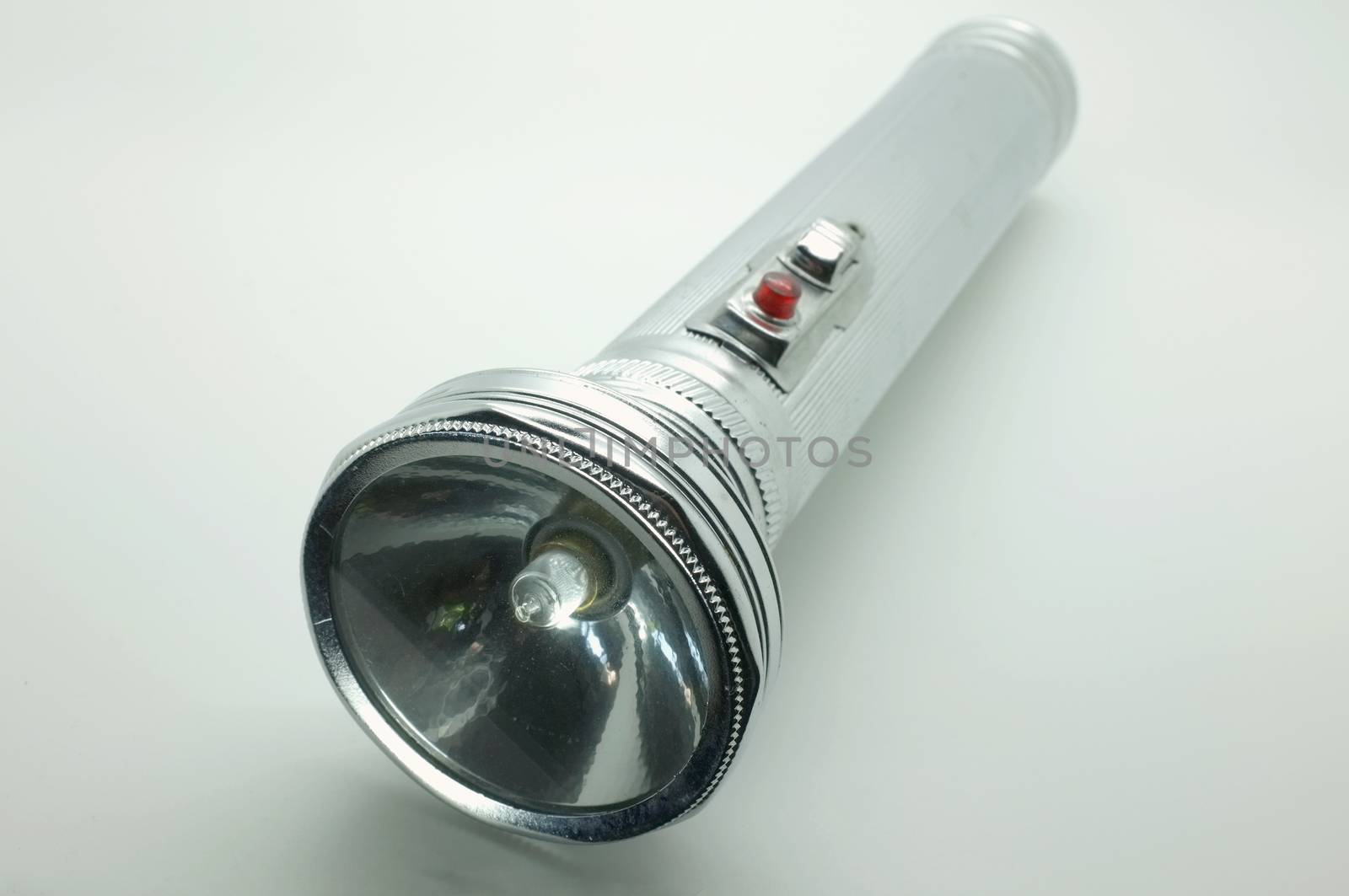 Old metal flashlight, silver torch