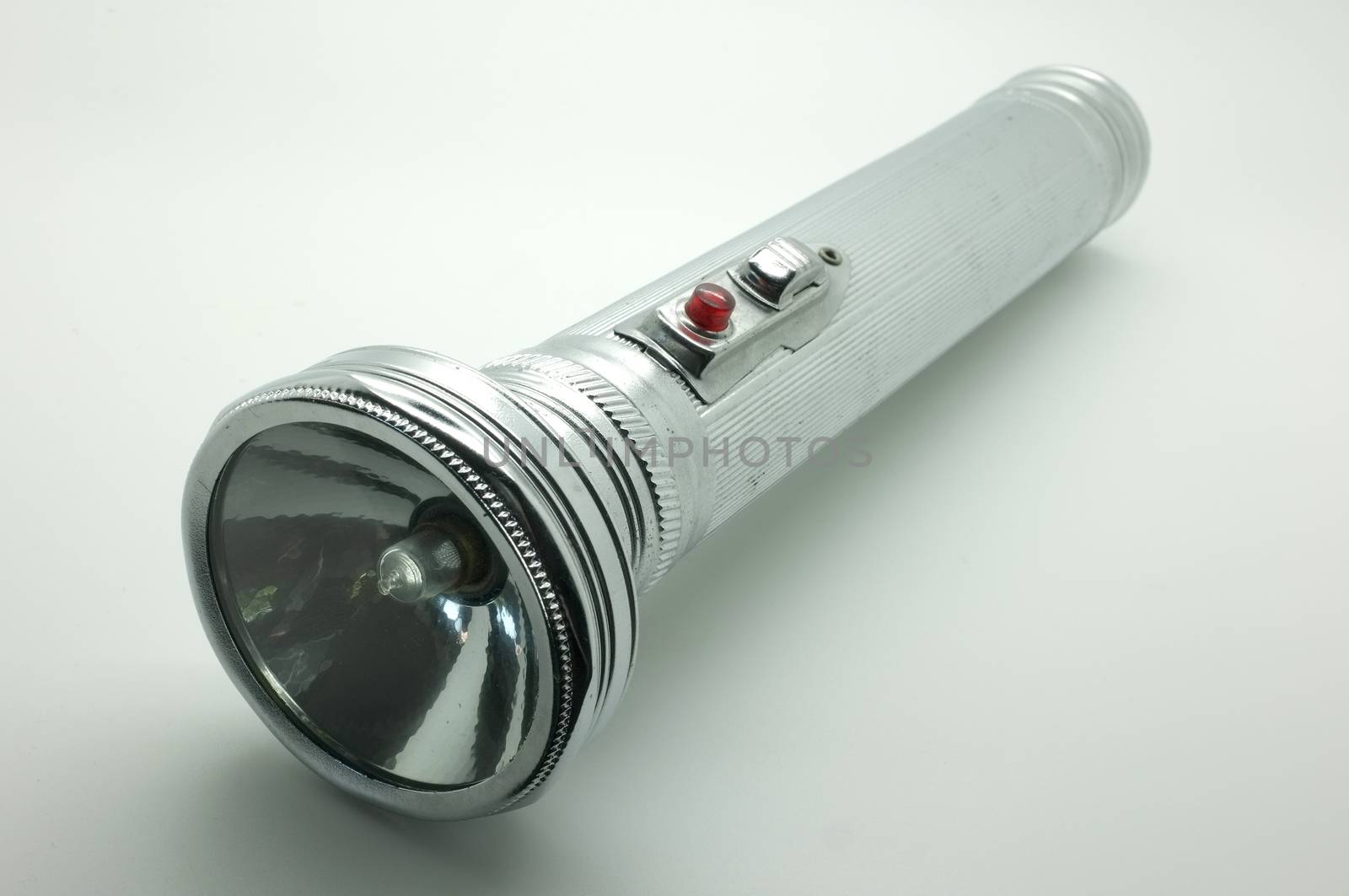 Old metal flashlight, silver torch