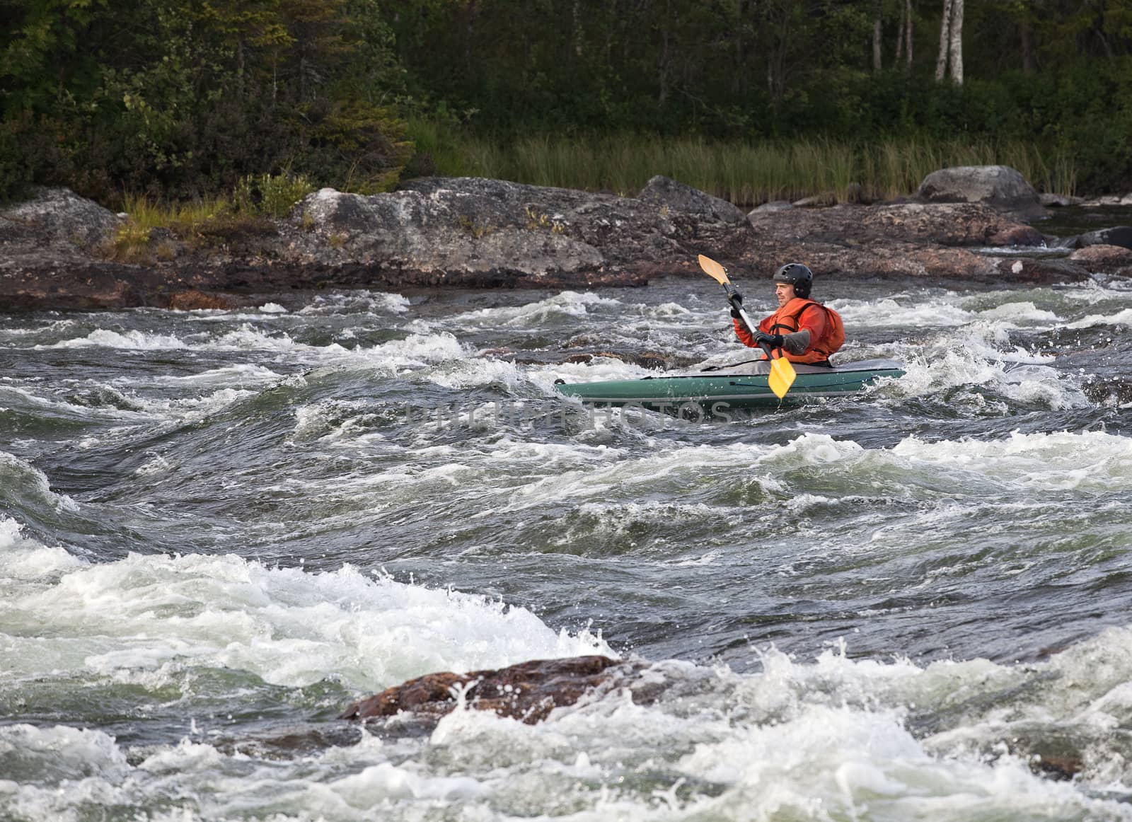 Kayaker in whitewater by Goodday