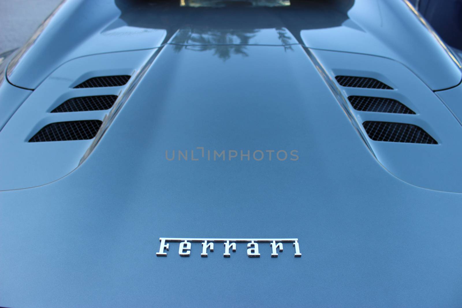 Monte-Carlo - JAN 12 : Logo of Ferrari on a Cowl of blue Sport Car parked in front of the Monte Carlo Casino, south of France on January 16, 2016 in Monte-Carlo, Monaco

