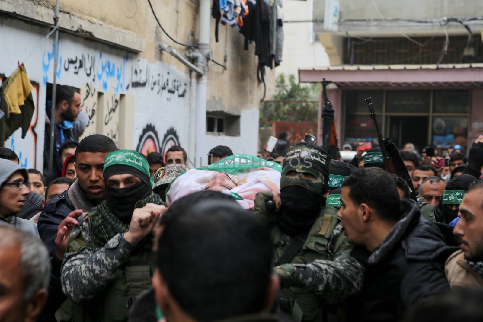 GAZA STRIP, Gaza City: Palestinian Hamas militants carry the body of one of the seven Hamas militants killed after a tunnel, built for fighting Israel, collapsed in the Gaza Strip, during their funeral in Gaza City on January 29, 2016.The Ezzedine Al-Qassam Brigades, Hamas's armed wing, said that four militants managed to escape after the collapse late on January 26 in the northeast of the strip.