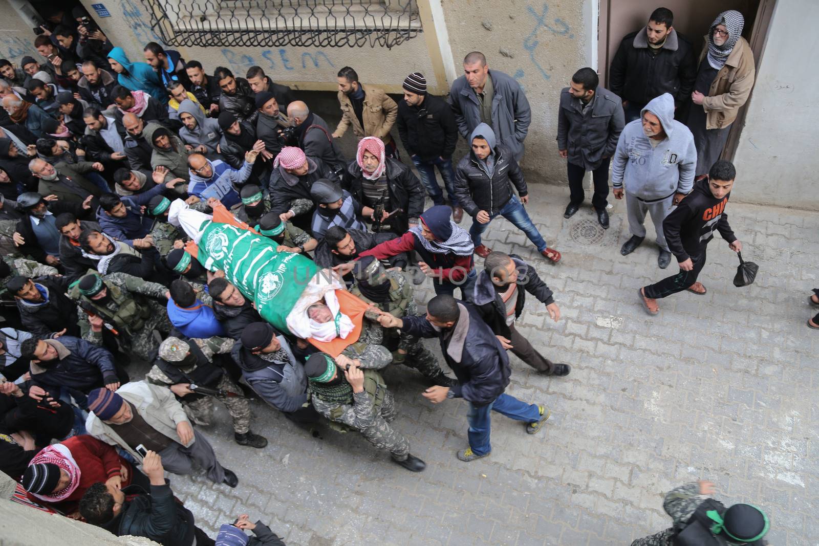 GAZA STRIP, Gaza City: Palestinian Hamas militants carry the body of one of the seven Hamas militants killed after a tunnel, built for fighting Israel, collapsed in the Gaza Strip, during their funeral in Gaza City on January 29, 2016.The Ezzedine Al-Qassam Brigades, Hamas's armed wing, said that four militants managed to escape after the collapse late on January 26 in the northeast of the strip.