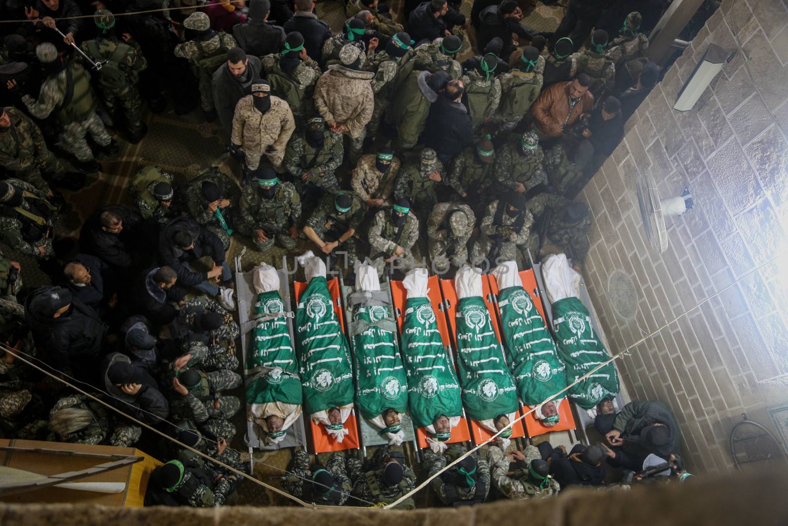 GAZA STRIP, Gaza City: Palestinians pray in front of the bodies of seven Hamas militants who were killed after a tunnel built for fighting Israel collapsed in the Gaza Strip, during their funeral in Gaza City on January 29, 2016.The Ezzedine Al-Qassam Brigades, Hamas's armed wing, said that four militants managed to escape after the collapse late on January 26 in the northeast of the strip.  