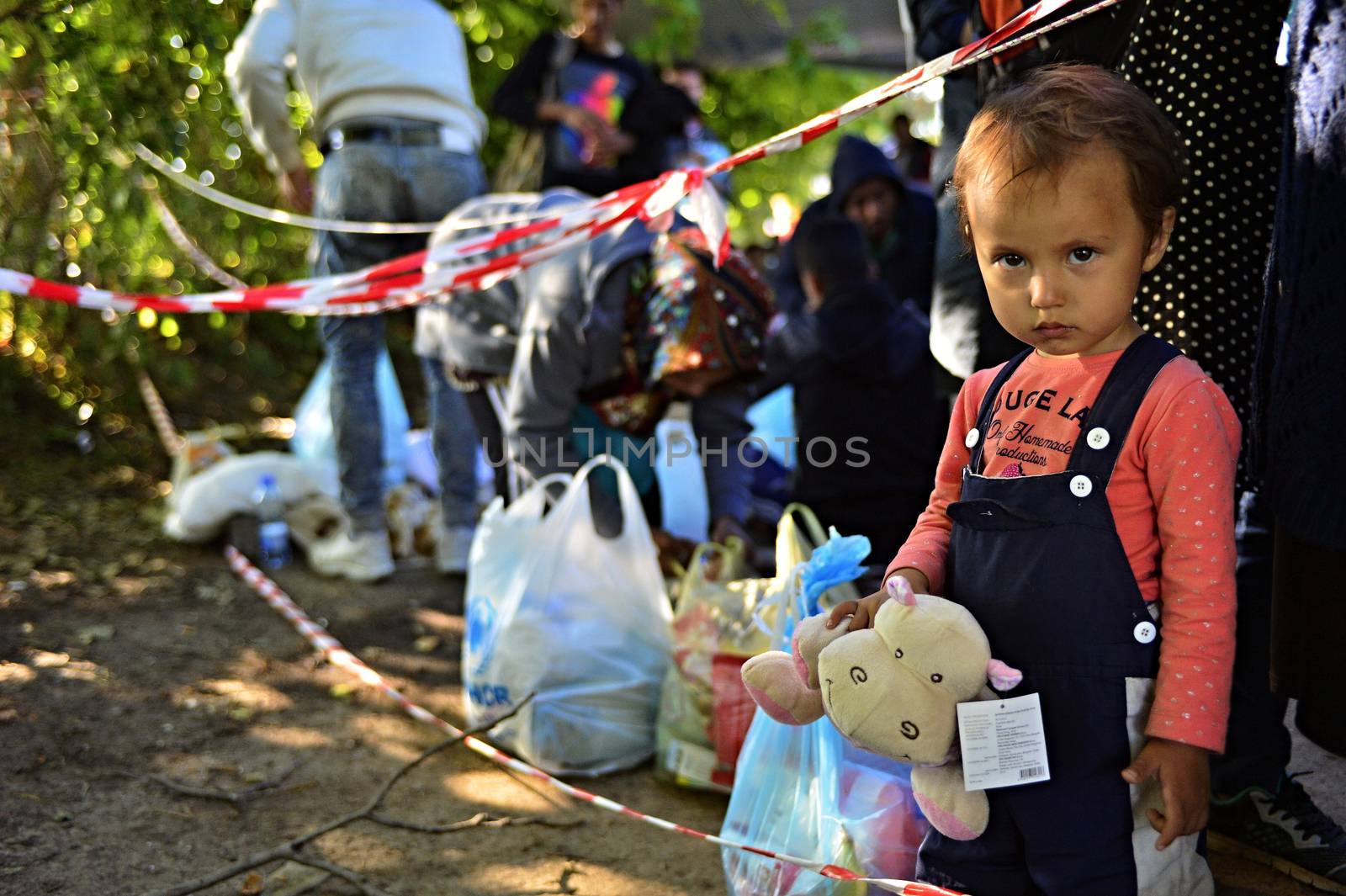 October 4, 2015; Bapska in Serbia. Group of refugees leaving Serbia. They came to Bapska by buses and then they leaving Serbia and go to Croatia and then to Germany. Many of them escapes from home because of civil war. 