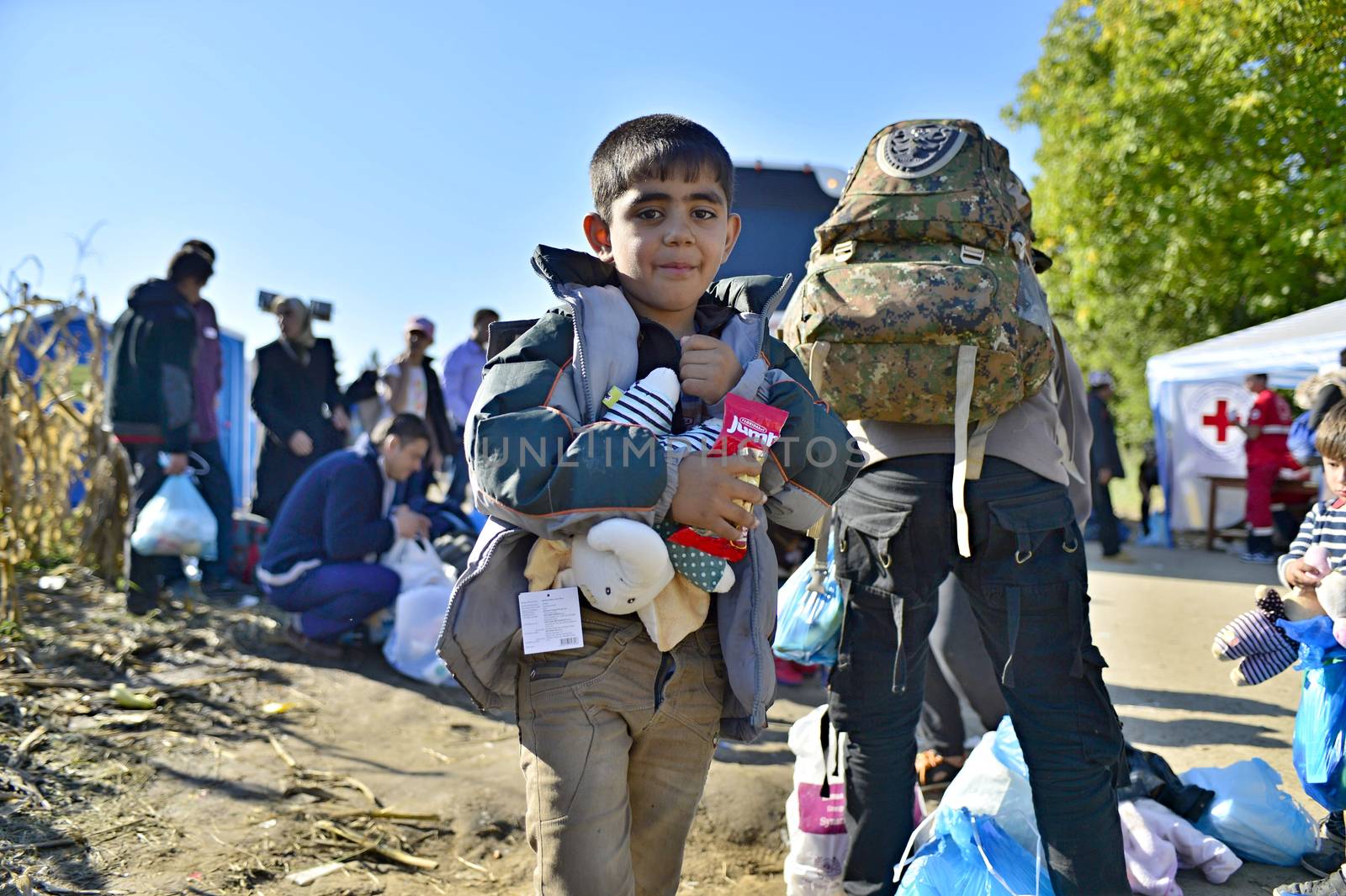 October 4, 2015; Bapska in Serbia. Group of refugees leaving Serbia. They came to Bapska by buses and then they leaving Serbia and go to Croatia and then to Germany. Many of them escapes from home because of civil war. 