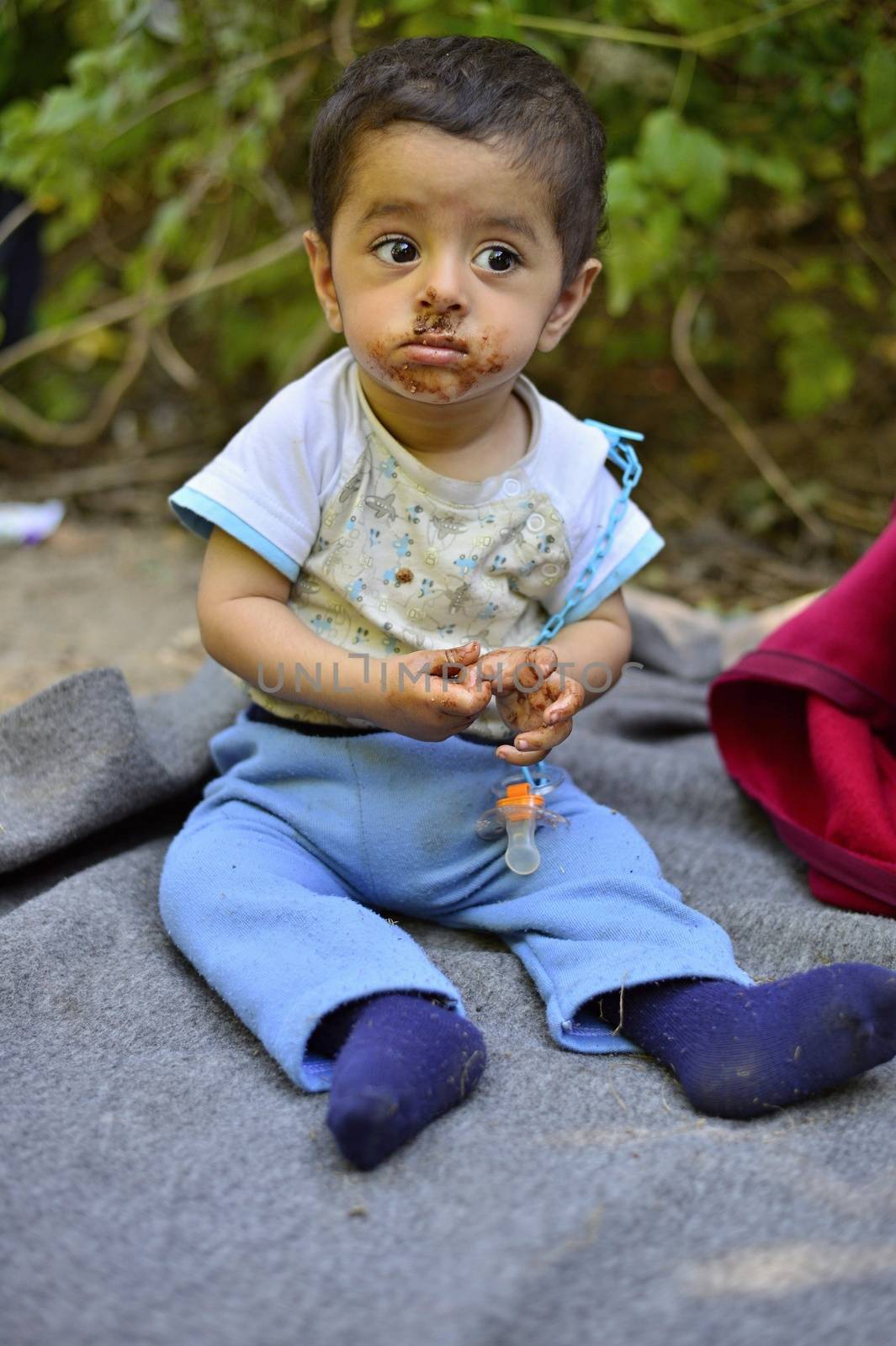 October 4, 2015; Bapska in Serbia. Group of refugees leaving Serbia. They came to Bapska by buses and then they leaving Serbia and go to Croatia and then to Germany. Many of them escapes from home because of civil war. 