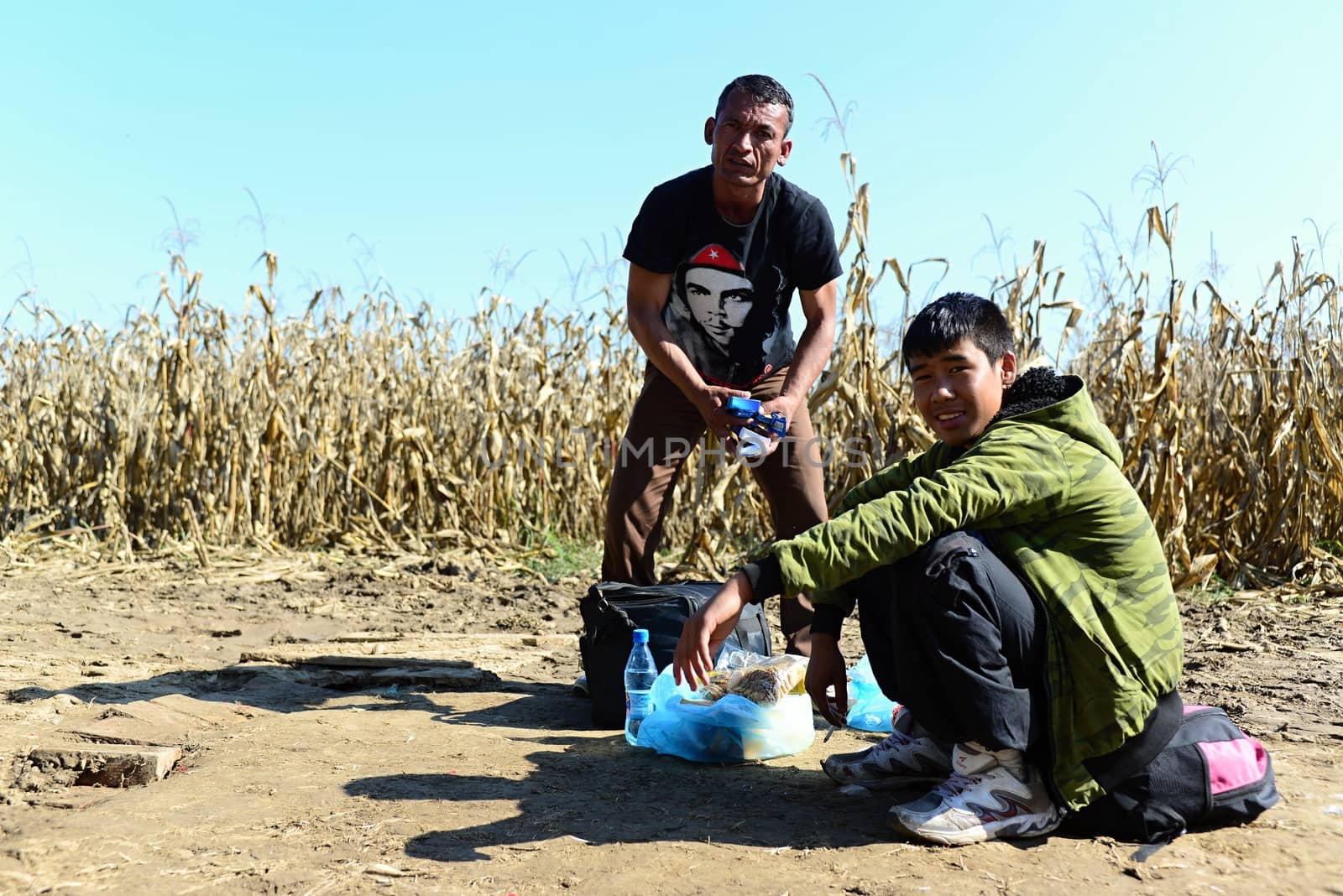 October 6,2015; Hegyeshalom in Hungary. Group of refugees leaving Hungary. They came to Hegyeshalom by train and then they leaving Hungary and go to Austria and then to Germany. Many of them escapes from home because of civil war. 