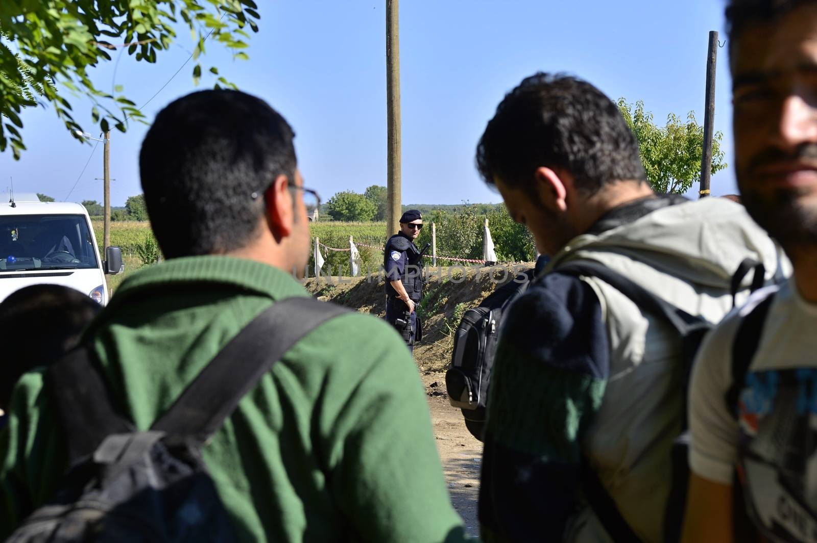 October 4, 2015; Bapska in Serbia. Group of refugees leaving Serbia. They came to Bapska by buses and then they leaving Serbia and go to Croatia and then to Germany. Many of them escapes from home because of civil war. 