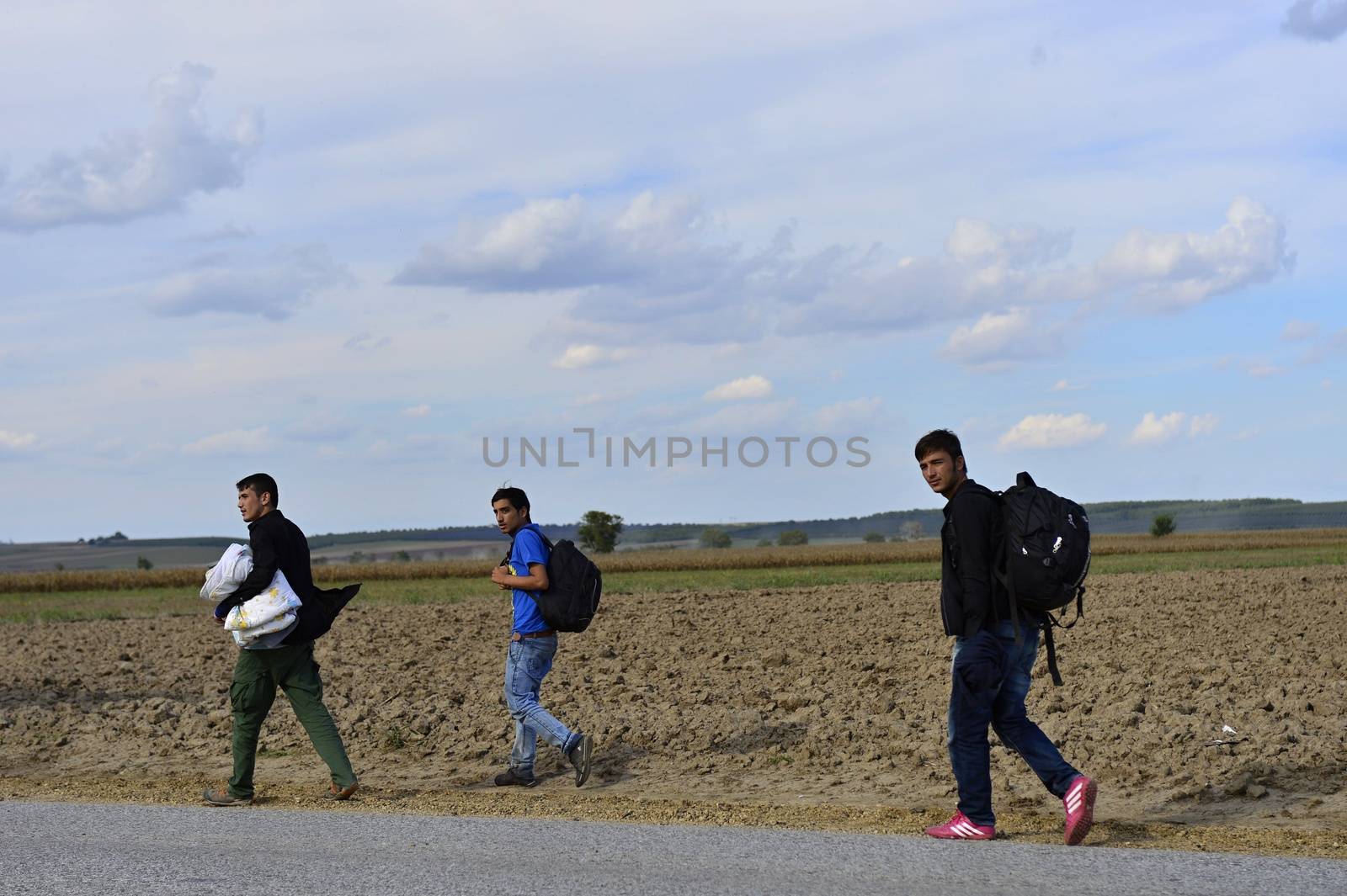 October 4, 2015; Sid in Serbia. Group of Afghan refugees leaving Serbia. They came to Sid by taxi and then they leaving Serbia and go to Croatia and then to Germany. Many of them escapes from home because of civil war. 