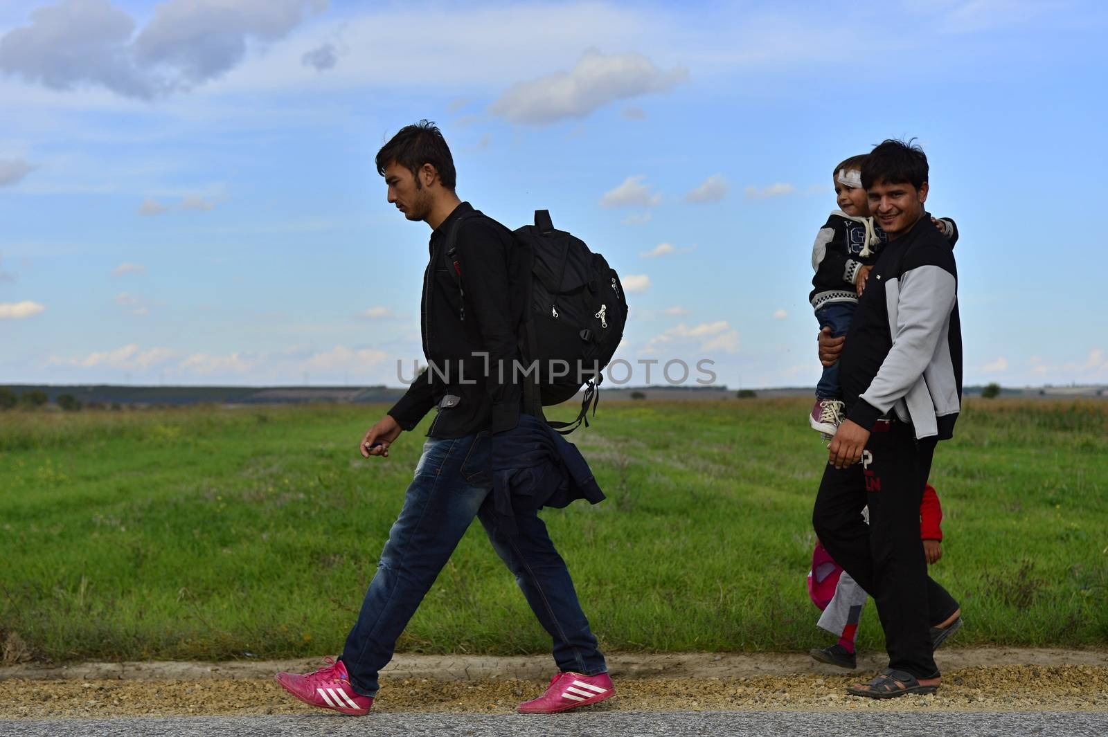 October 4, 2015; Sid in Serbia. Group of Afghan refugees leaving Serbia. They came to Sid by taxi and then they leaving Serbia and go to Croatia and then to Germany. Many of them escapes from home because of civil war. 