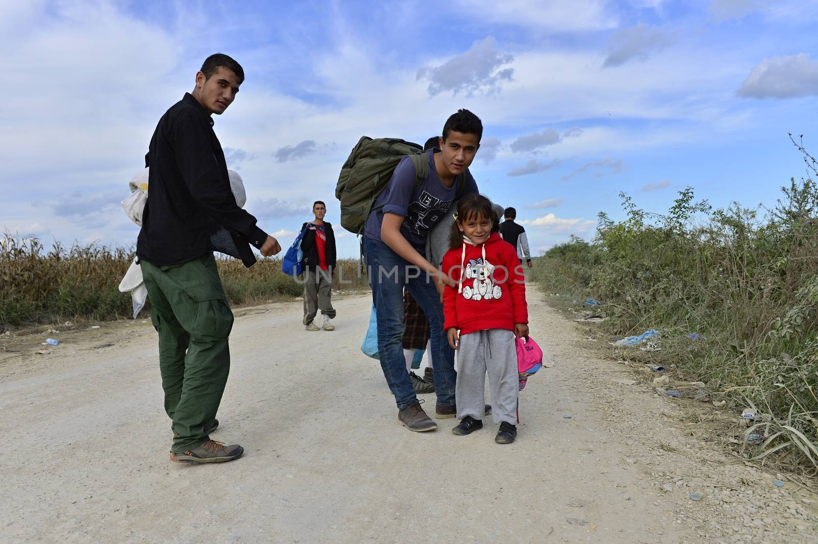 October 4, 2015; Sid in Serbia. Group of Afghan refugees leaving Serbia. They came to Sid by taxi and then they leaving Serbia and go to Croatia and then to Germany. Many of them escapes from home because of civil war. 