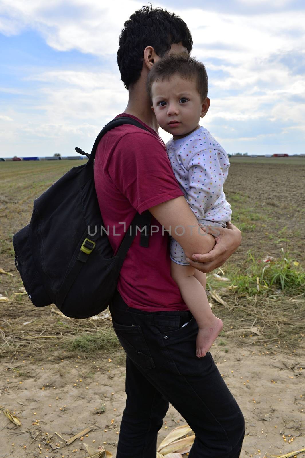 October 4, 2015; Sid in Serbia. Group of Afghan refugees leaving Serbia. They came to Sid by taxi and then they leaving Serbia and go to Croatia and then to Germany. Many of them escapes from home because of civil war. 
