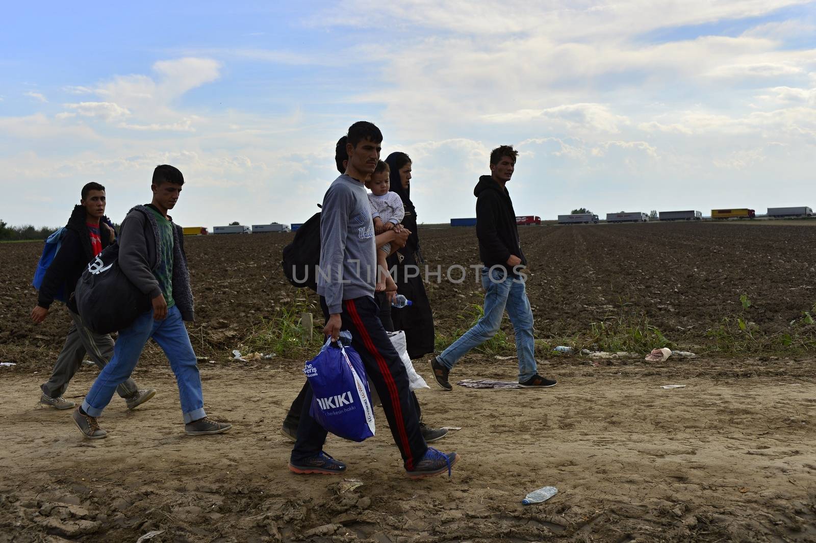 October 4, 2015; Sid in Serbia. Group of Afghan refugees leaving Serbia. They came to Sid by taxi and then they leaving Serbia and go to Croatia and then to Germany. Many of them escapes from home because of civil war. 