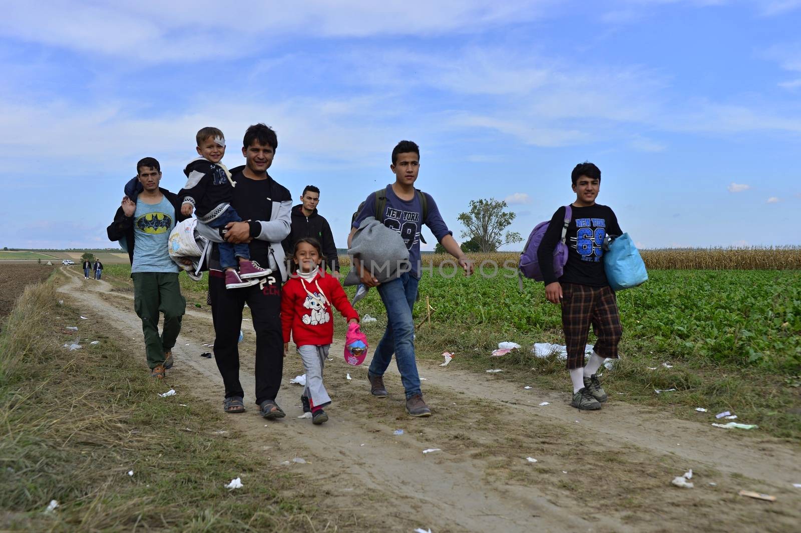 October 4, 2015; Sid in Serbia. Group of Afghan refugees leaving Serbia. They came to Sid by taxi and then they leaving Serbia and go to Croatia and then to Germany. Many of them escapes from home because of civil war. 