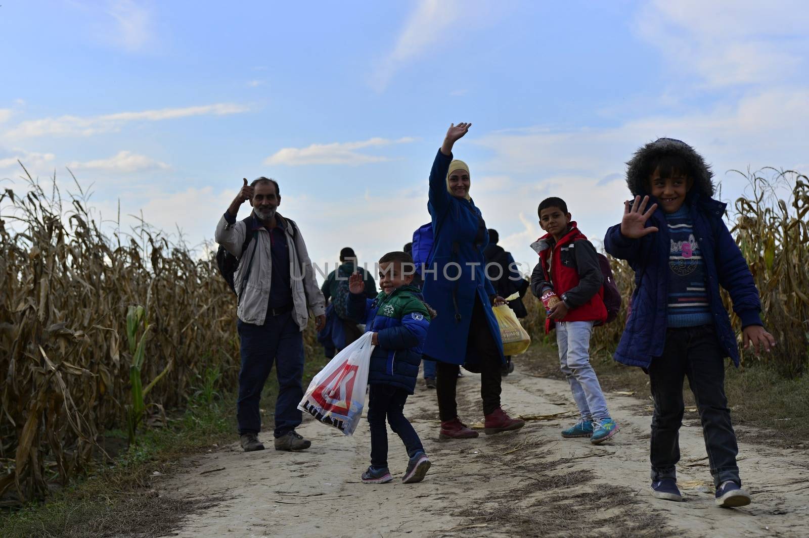 October 4, 2015; Sid in Serbia. Group of Afghan refugees leaving Serbia. They came to Sid by taxi and then they leaving Serbia and go to Croatia and then to Germany. Many of them escapes from home because of civil war. 