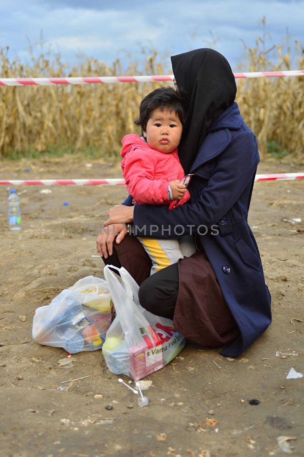 October 4, 2015; Bapska in Serbia. Group of refugees leaving Serbia. They came to Bapska by buses and then they leaving Serbia and go to Croatia and then to Germany. Many of them escapes from home because of civil war. 