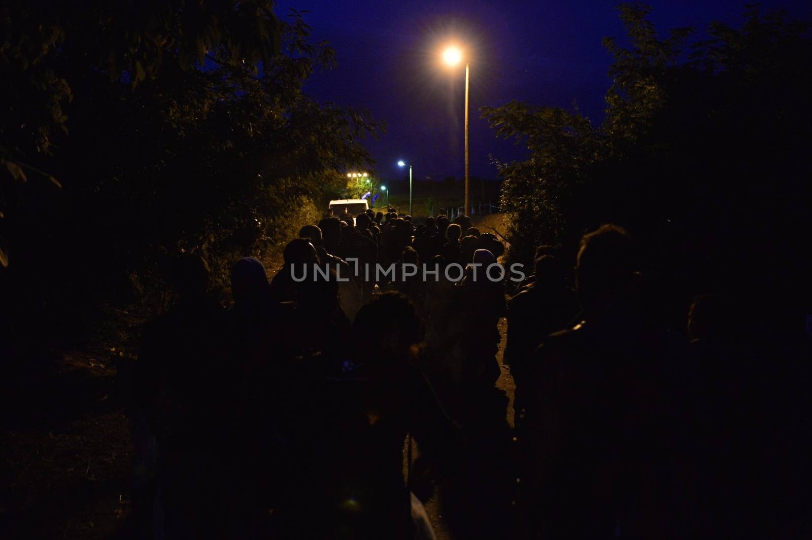 October 4, 2015; Bapska in Serbia. Group of refugees leaving Serbia. They came to Bapska by buses and then they leaving Serbia and go to Croatia and then to Germany. Many of them escapes from home because of civil war. 