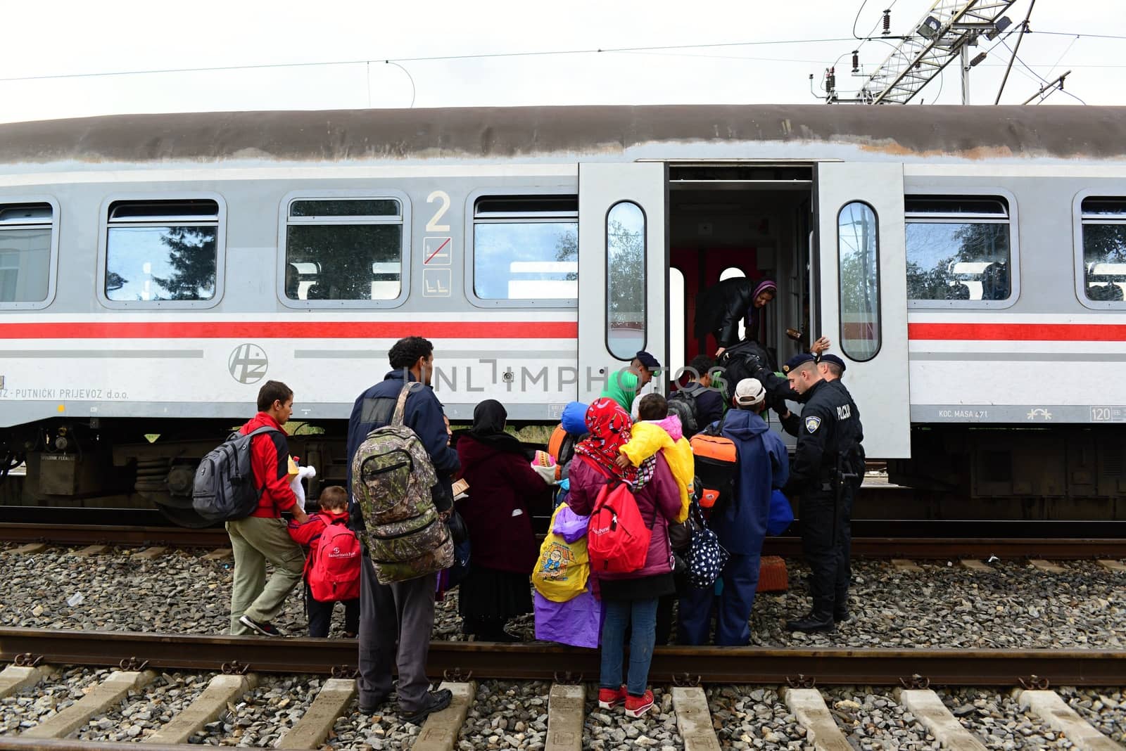 October 6,2015; Hegyeshalom in Hungary. Group of refugees leaving Hungary. They came to Hegyeshalom by train and then they leaving Hungary and go to Austria and then to Germany. Many of them escapes from home because of civil war. 