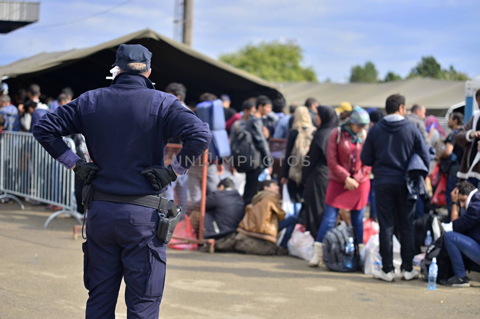 October 5, 2015; Tovarnik in Croatia. Croatian police assist refugees get into train which will go to Hungary.
