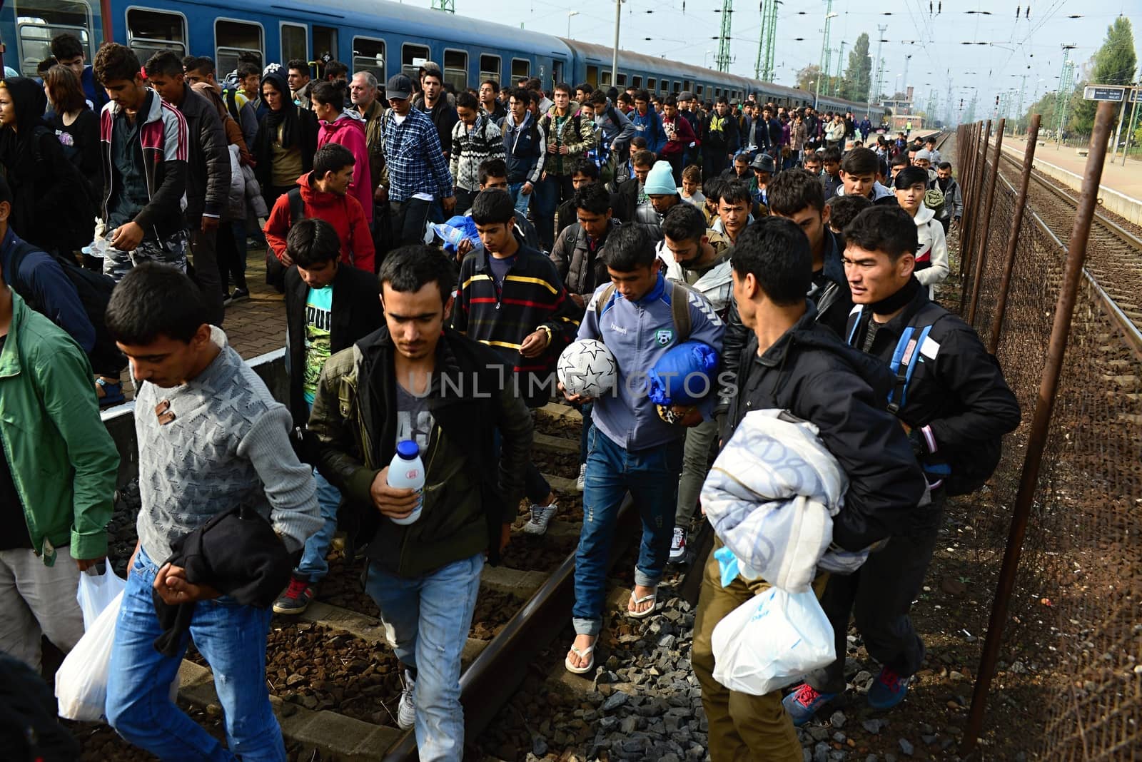 October 6,2015; Hegyeshalom in Hungary. Group of refugees leaving Hungary. They came to Hegyeshalom by train and then they leaving Hungary and go to Austria and then to Germany. Many of them escapes from home because of civil war. 