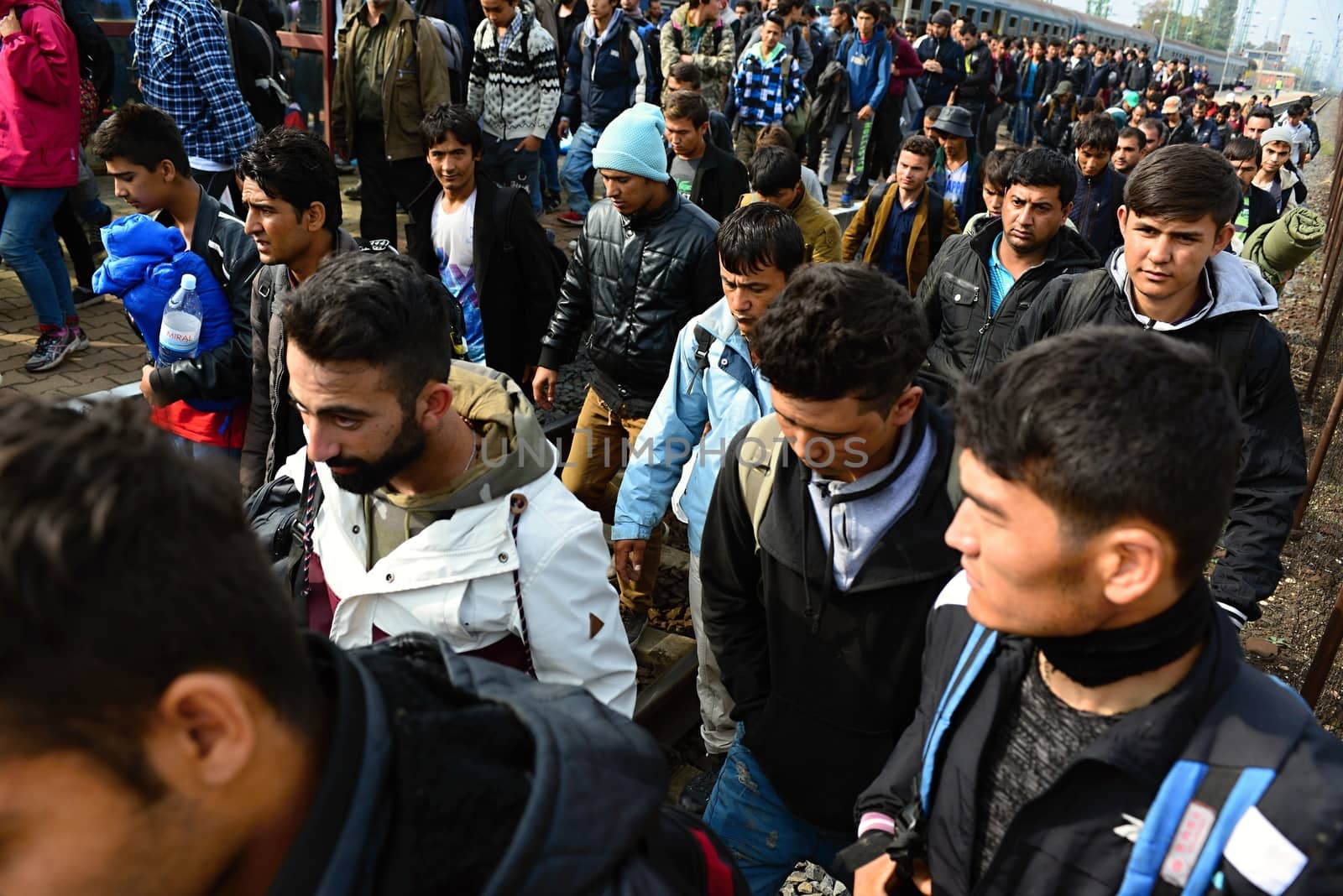 October 6,2015; Hegyeshalom in Hungary. Group of refugees leaving Hungary. They came to Hegyeshalom by train and then they leaving Hungary and go to Austria and then to Germany. Many of them escapes from home because of civil war. 