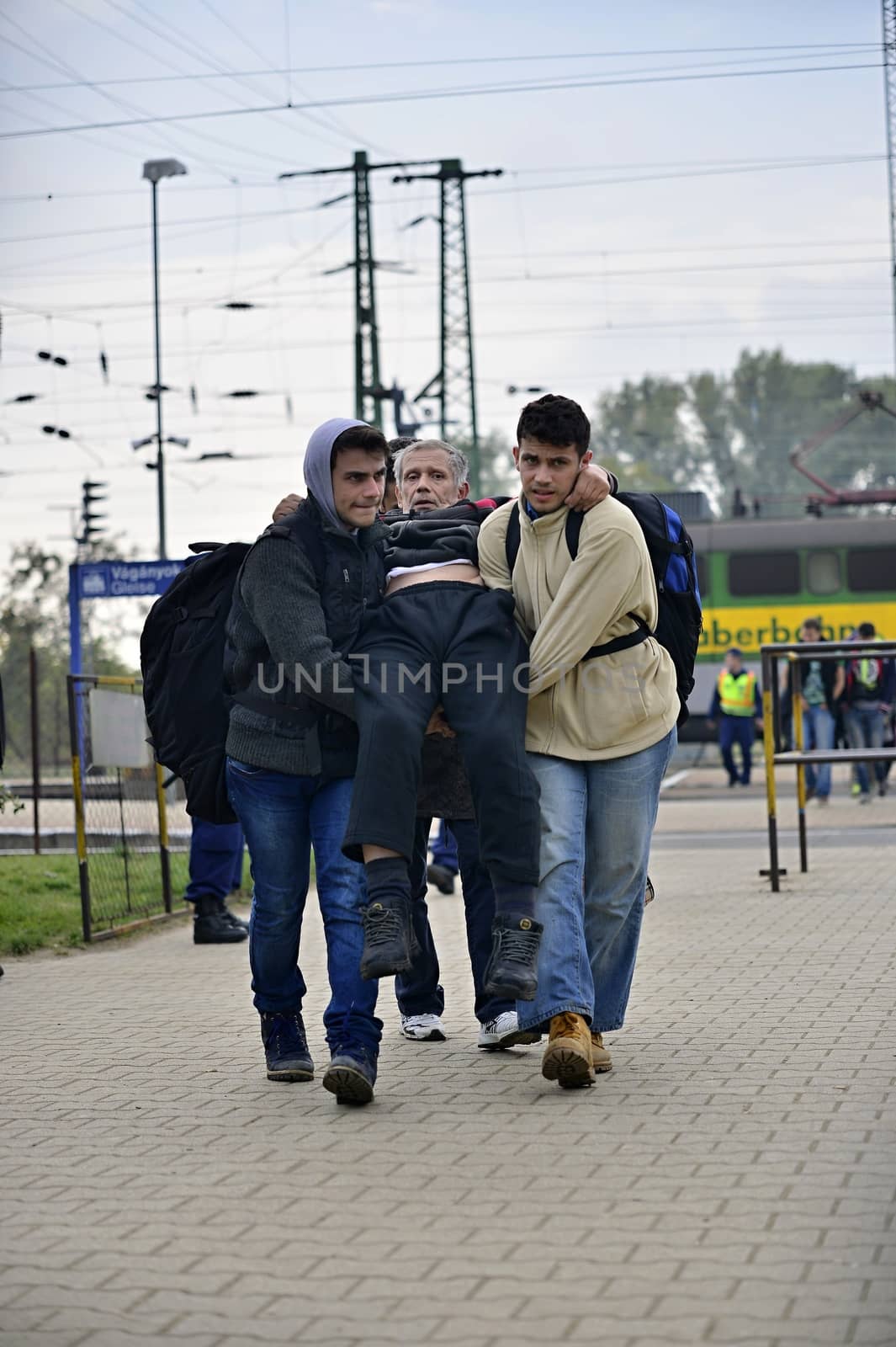 October 6,2015; Hegyeshalom in Hungary. Group of refugees leaving Hungary. They came to Hegyeshalom by train and then they leaving Hungary and go to Austria and then to Germany. Many of them escapes from home because of civil war. 