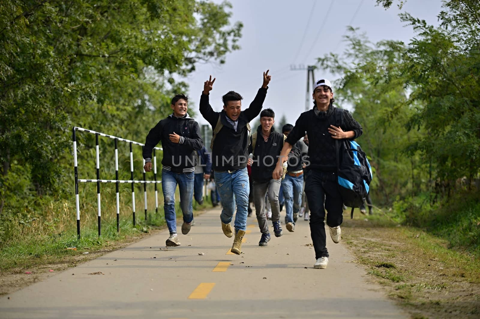 October 6,2015; Hegyeshalom in Hungary. Group of refugees leaving Hungary. They came to Hegyeshalom by train and then they leaving Hungary and go to Austria and then to Germany. Many of them escapes from home because of civil war. 