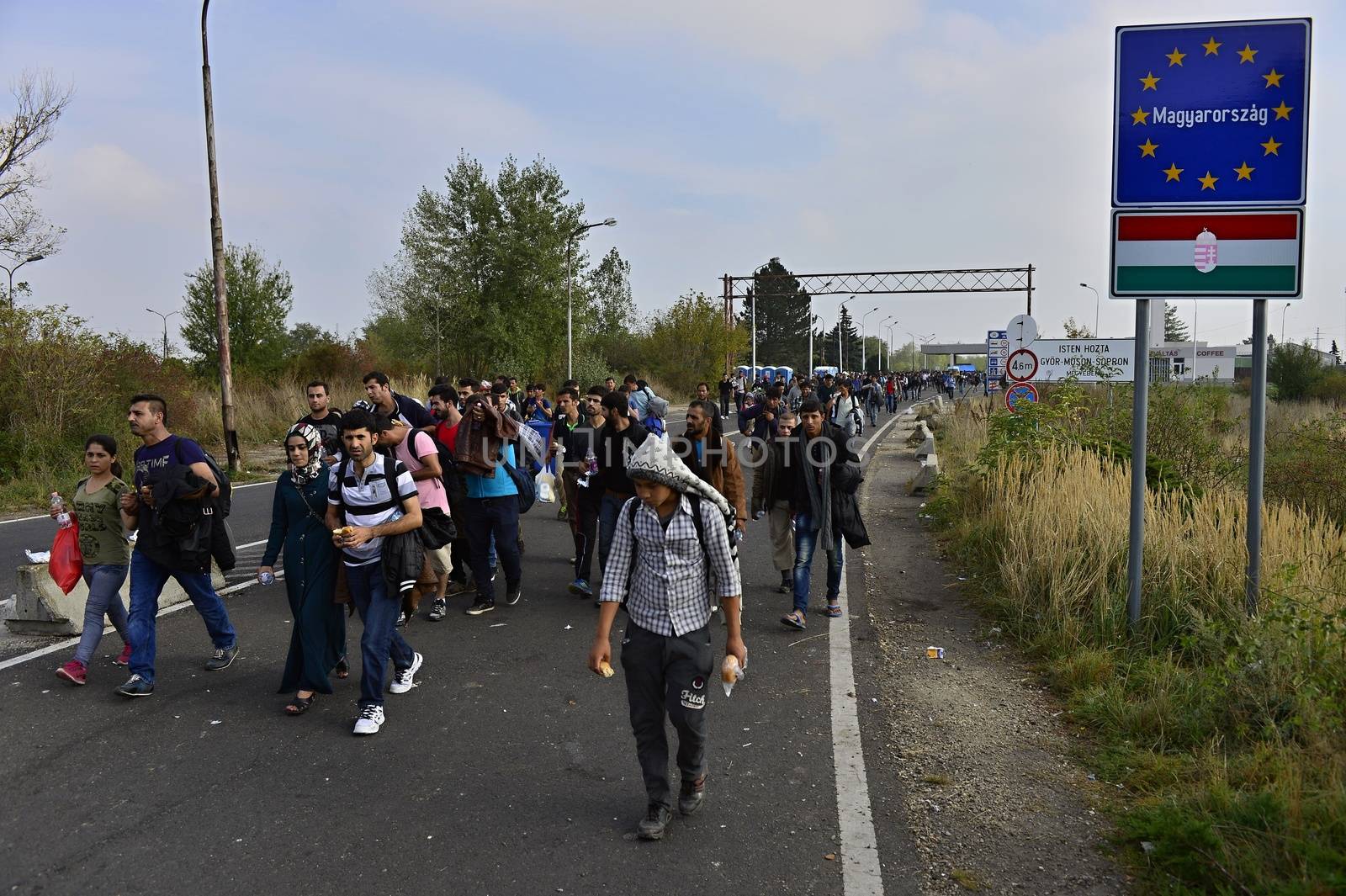 October 6,2015; Hegyeshalom in Hungary. Group of refugees leaving Hungary. They came to Hegyeshalom by train and then they leaving Hungary and go to Austria and then to Germany. Many of them escapes from home because of civil war. 