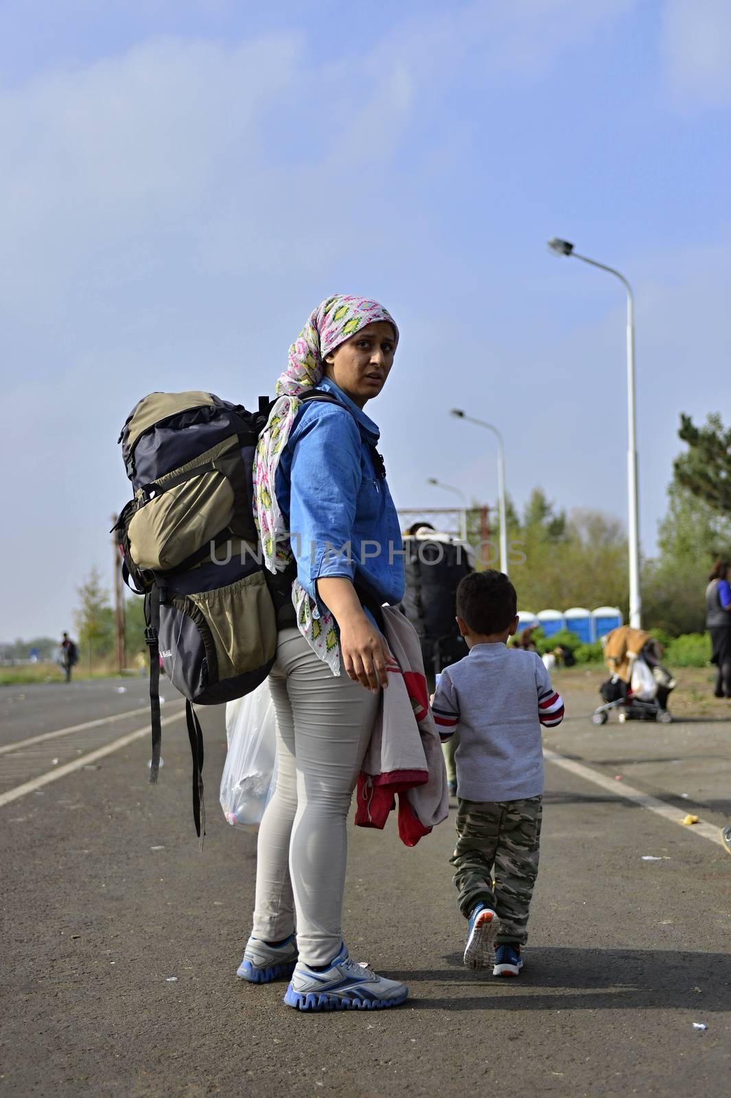 October 6,2015; Hegyeshalom in Hungary. Group of refugees leaving Hungary. They came to Hegyeshalom by train and then they leaving Hungary and go to Austria and then to Germany. Many of them escapes from home because of civil war. 