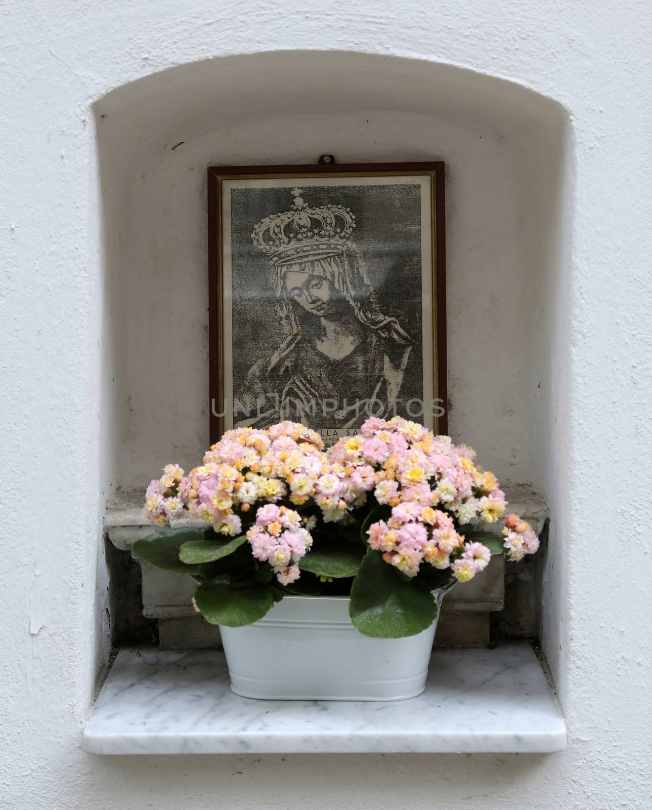 Manarola Italy, Liguria, Cinque Terre, a religious chantry with a Madonna statue in one of the streets of the center