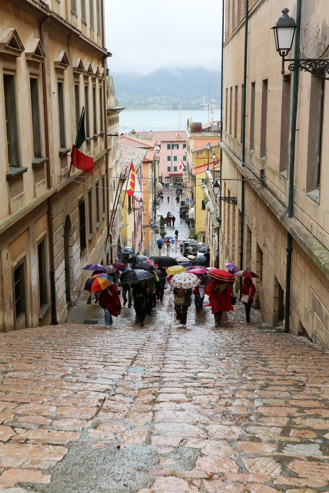 Tourists walking up stairs in street on May 03, 2014 Portoferraio, Italy