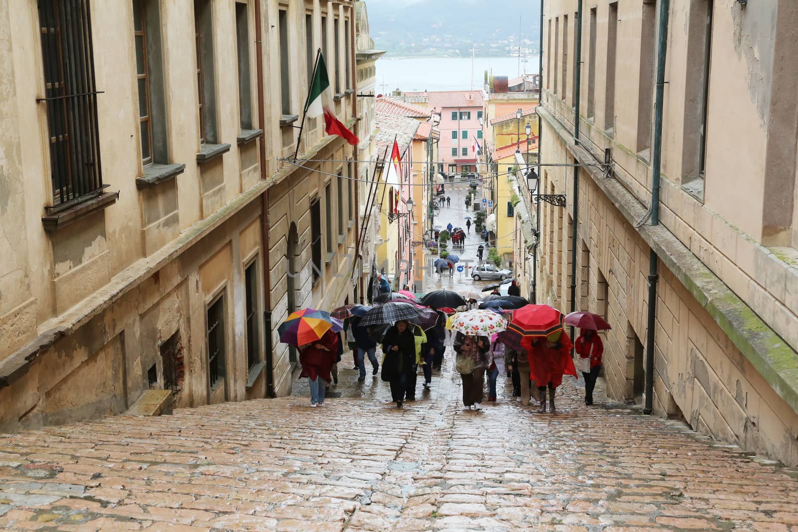 Tourists walking up stairs in street on May 03, 2014 Portoferraio, Italy