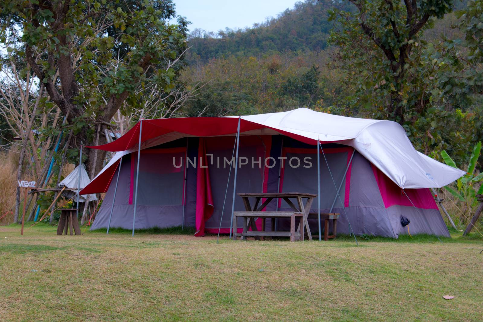 Tourist tent in camp among meadow in the mountain