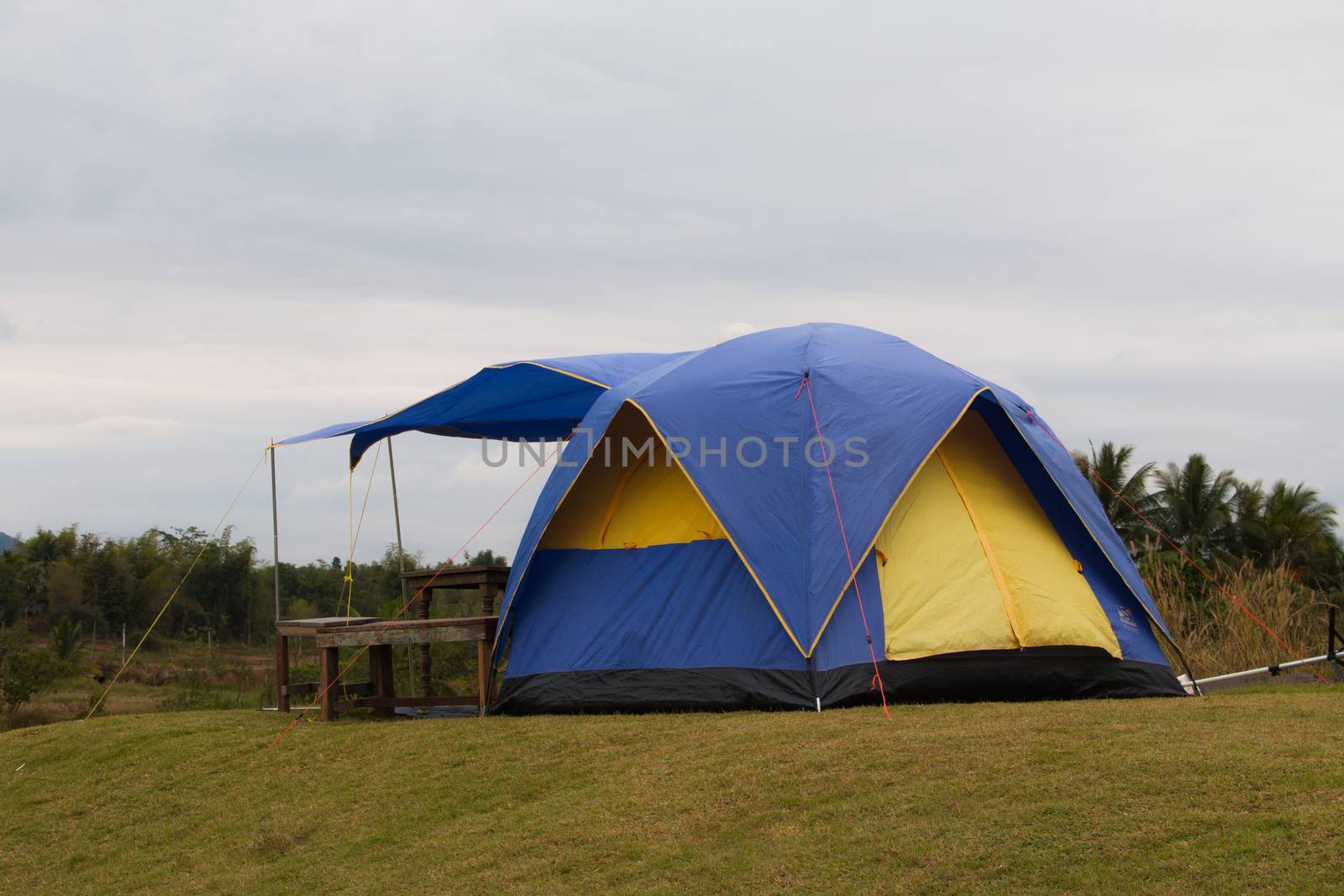 Tourist tent in camp among meadow in the mountain by N_u_T