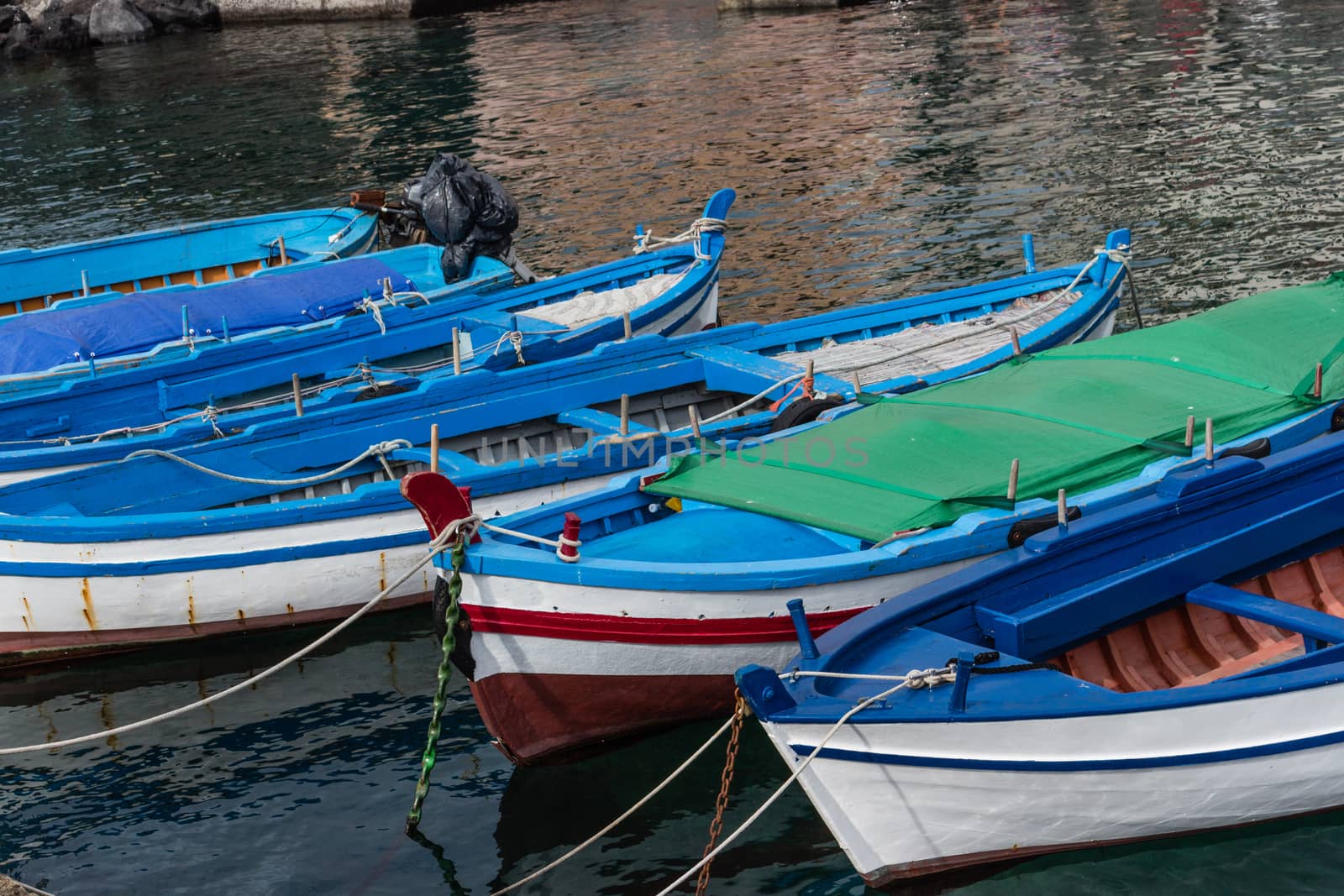 Small boats anchored in Sicily, Italy. by alanstix64