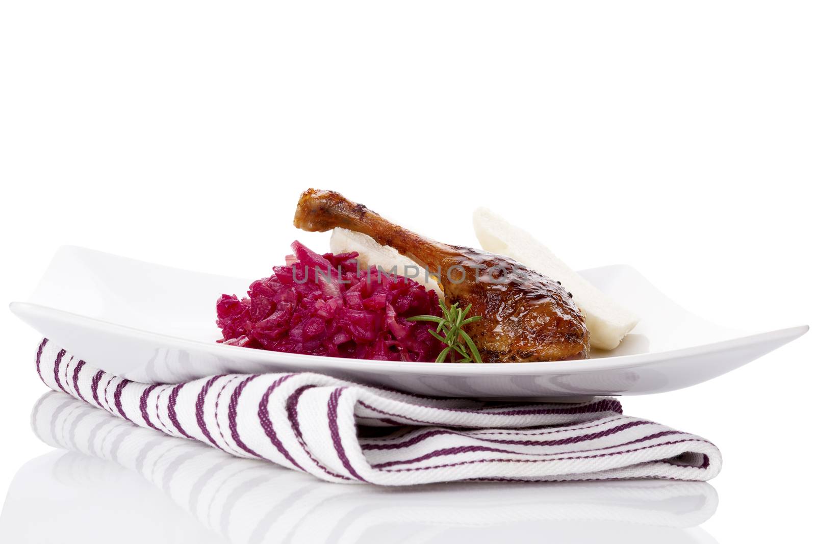 Delicious roast duck with red cabbage and dumplings. Traditional festive eating. 