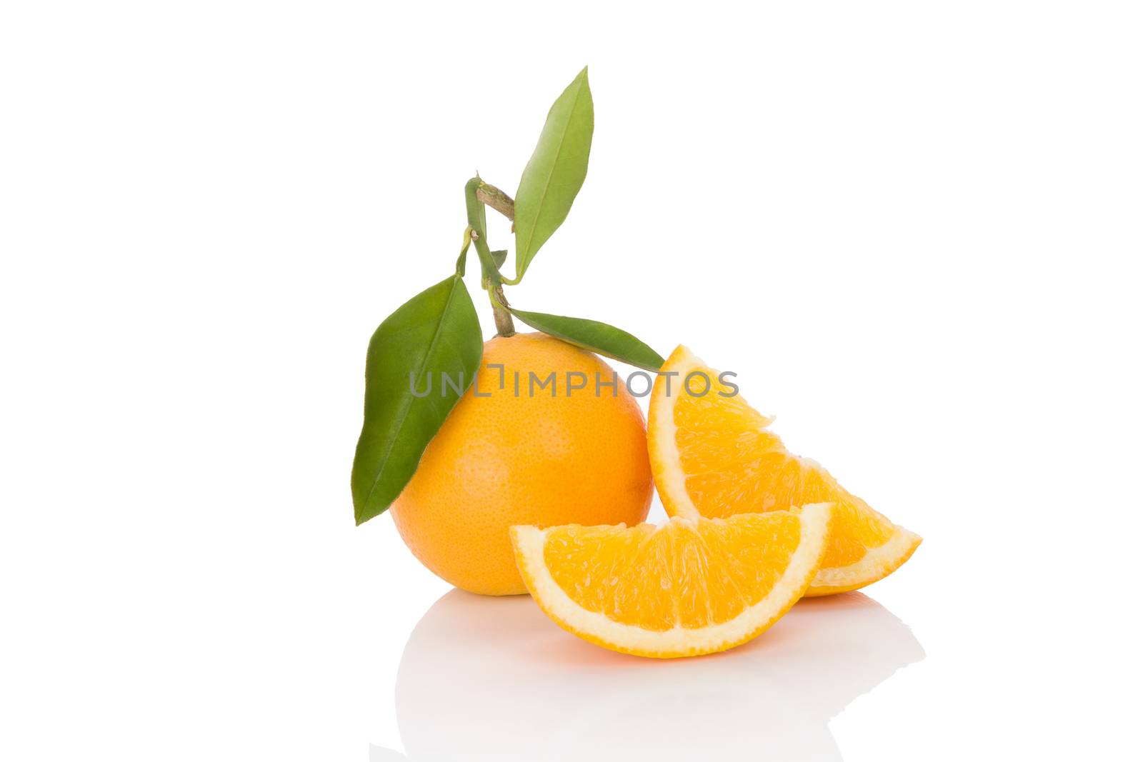 Delicious whole oranges with leaves and slices isolated on white background. Healthy fruit eating. 