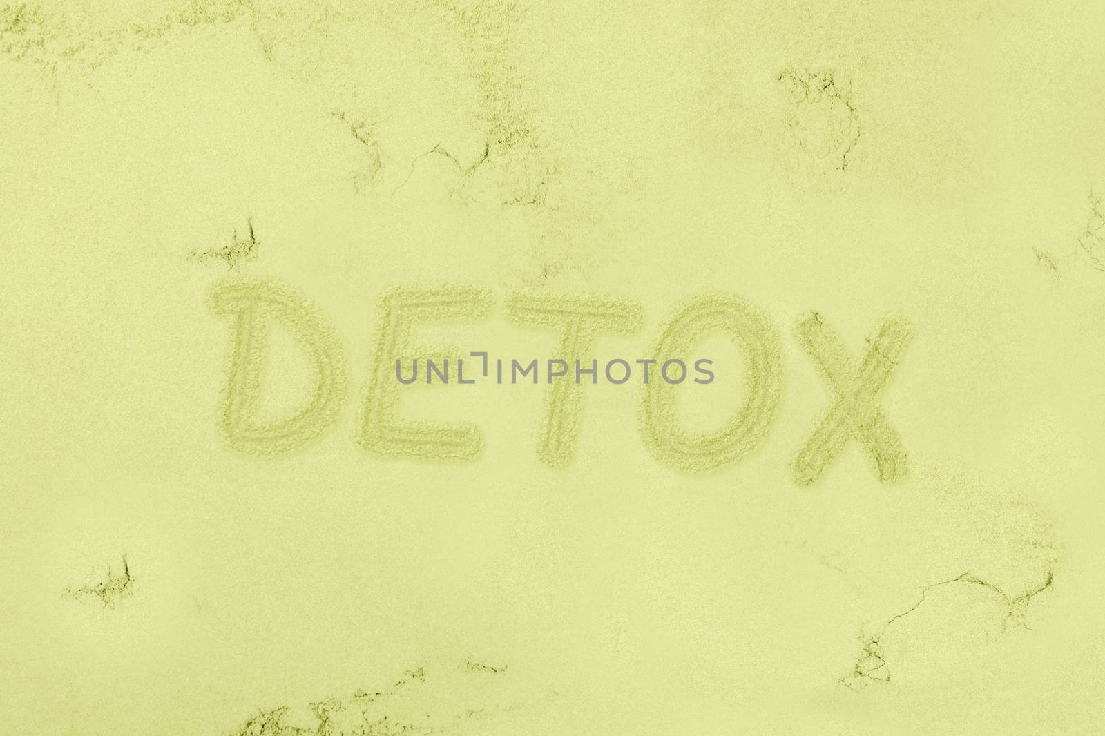 Green detox background. Seamless green ground powder background with the word detox written in it. Green food supplement. Wheatgrass, chlorella and spirulina. Green pills and ground powder. Healthy lifestyle.