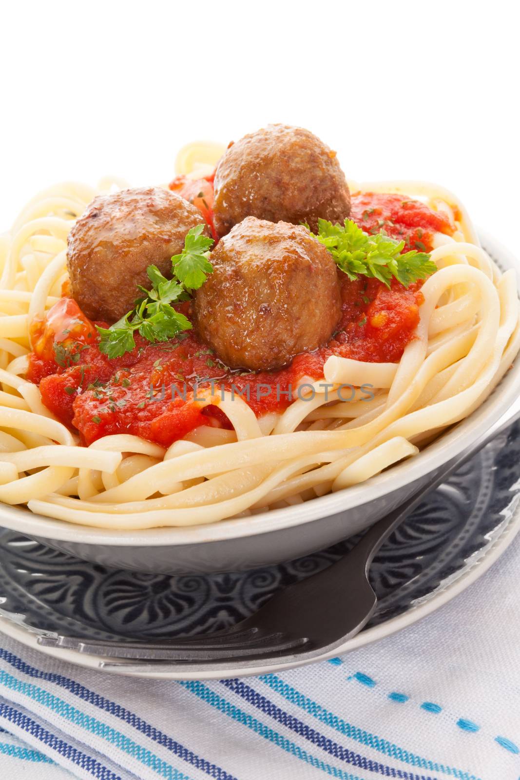 Delicious pasta with tomato sauce and meatballs. Traditional mediterranean eating. 