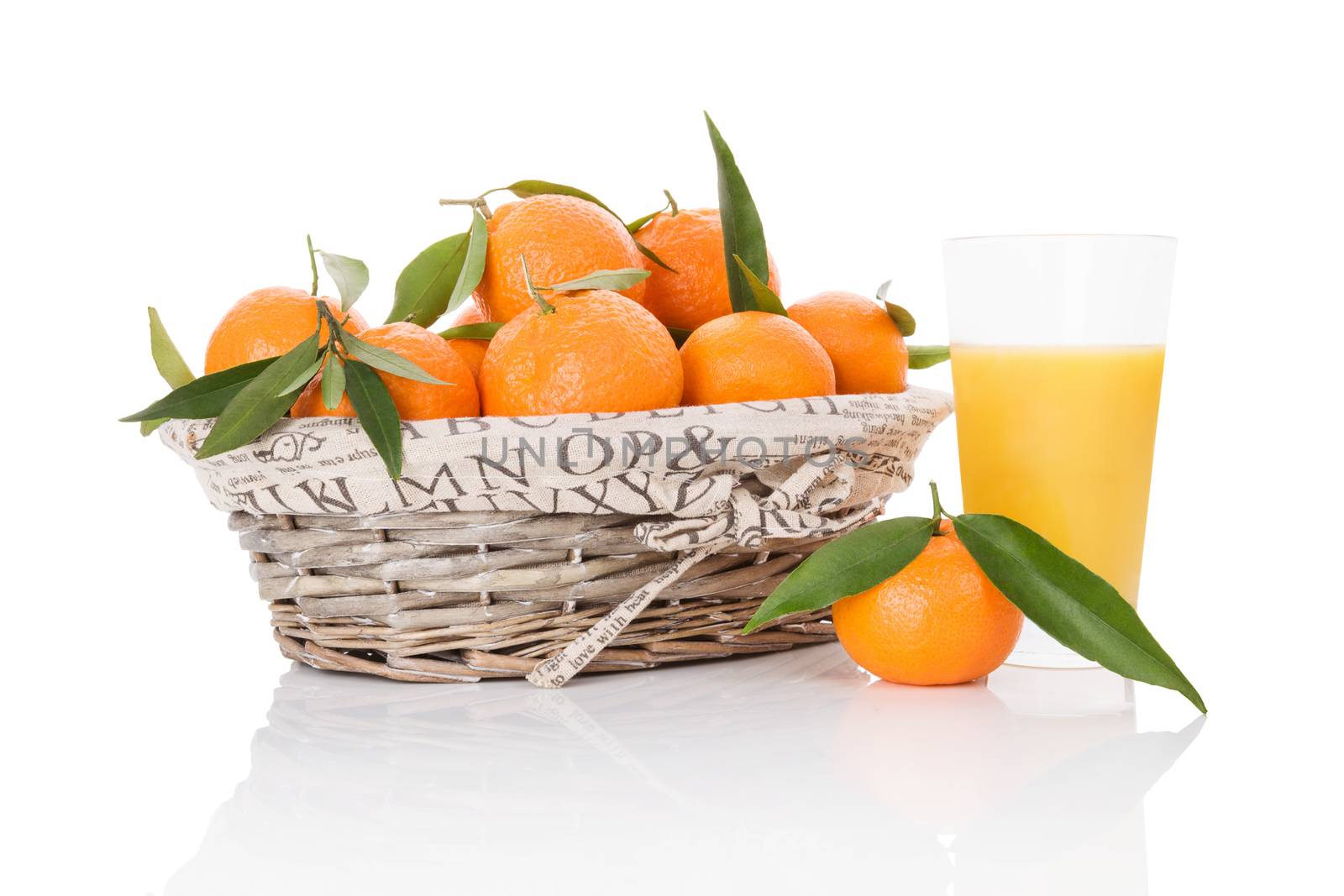 Mandarines in white wooden basket. by eskymaks