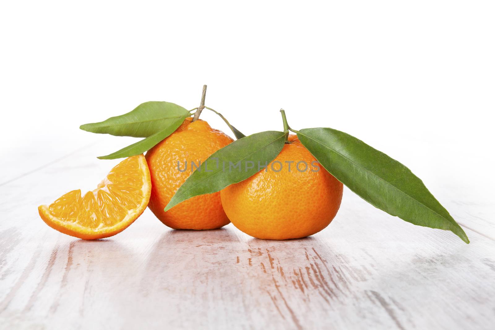 Mandarine fruit on white wooden table. Provence style.